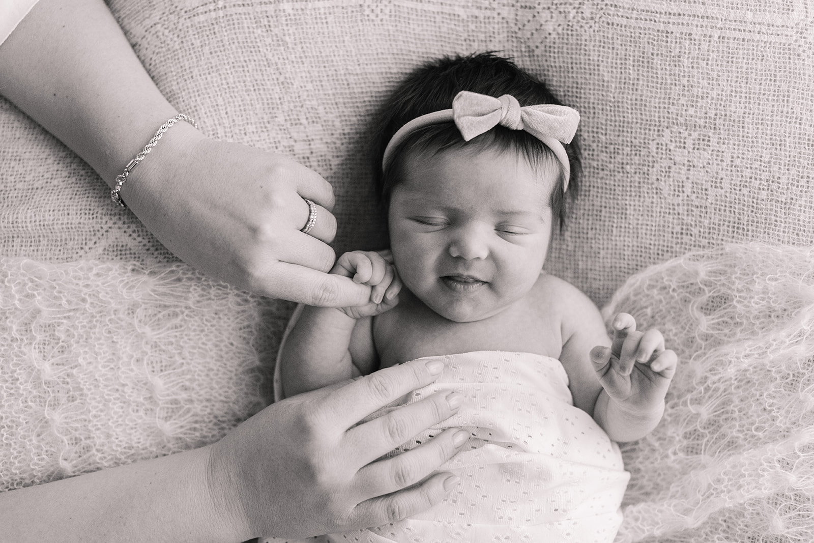 sleepy newborn baby girl