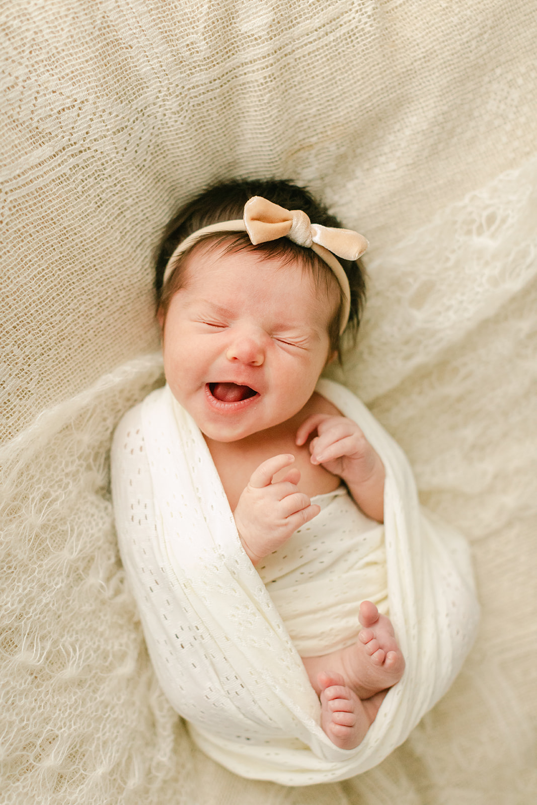 sleepy newborn baby girl