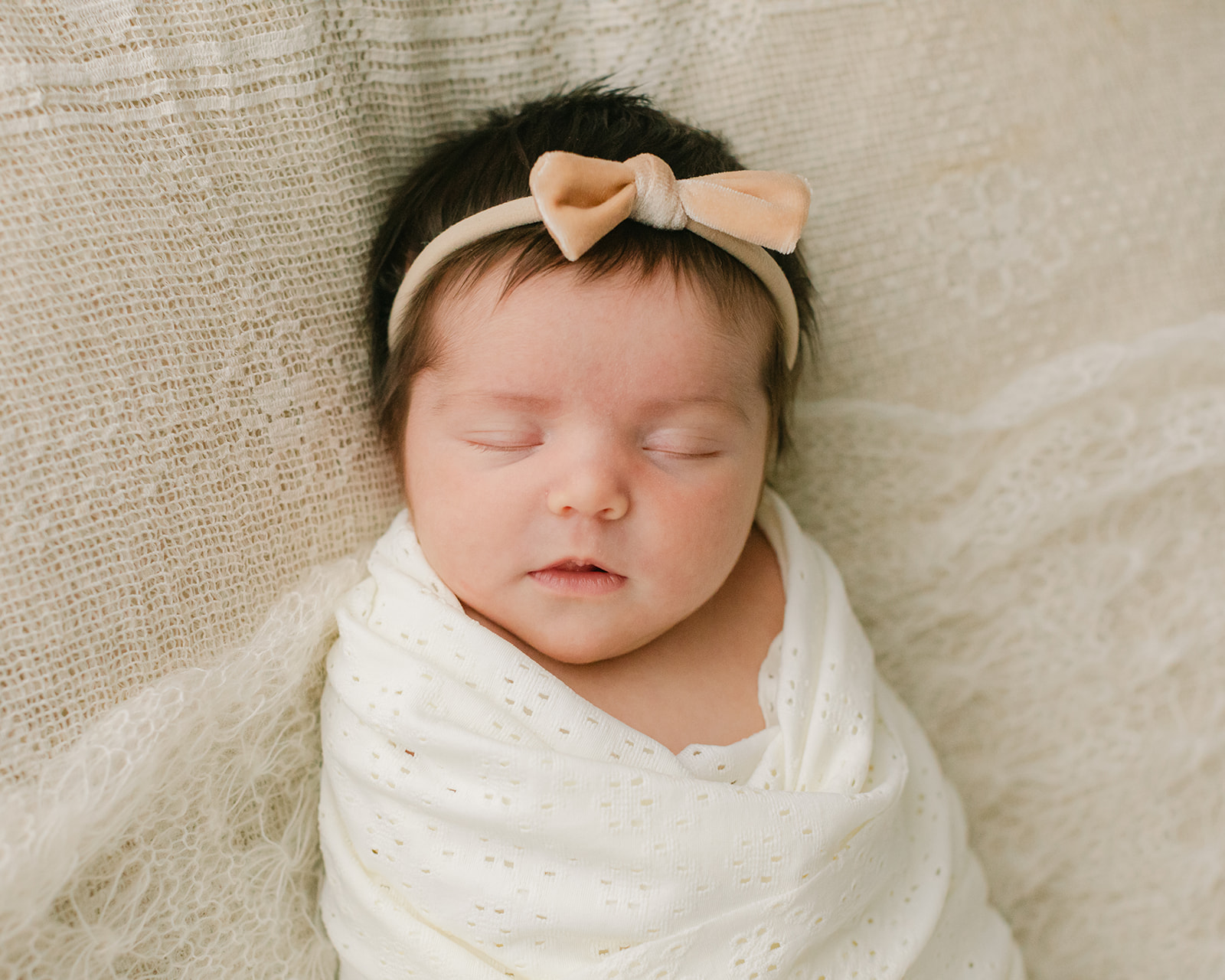 sleepy newborn baby girl