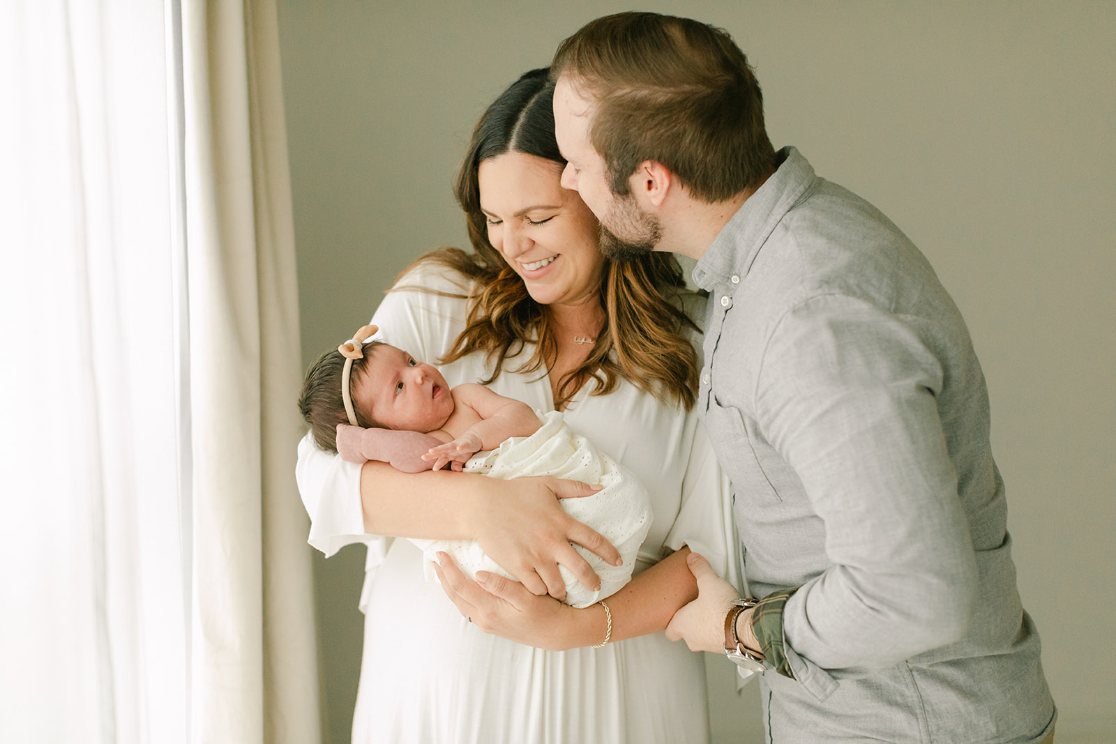parents with newborn baby girl