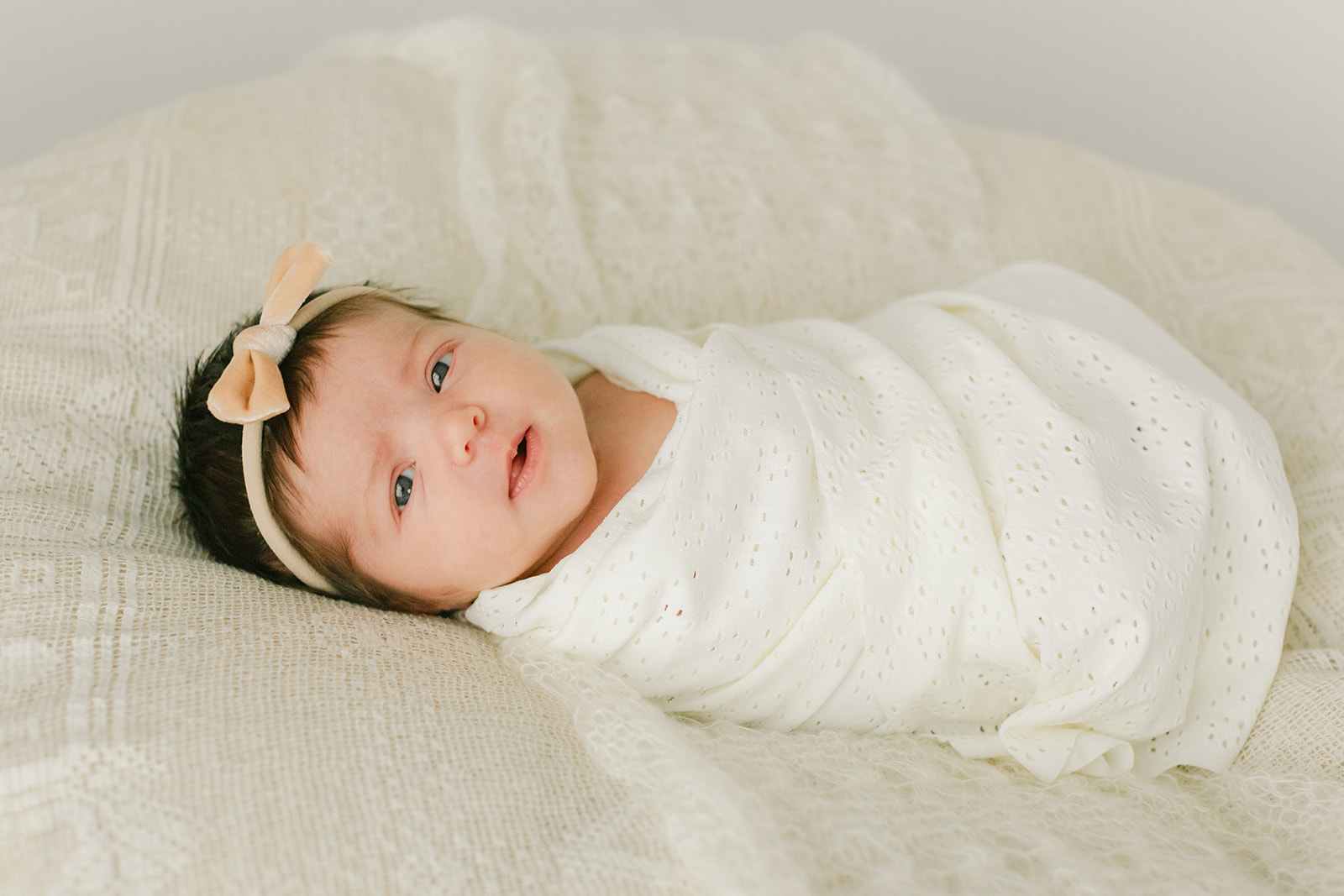 sleepy newborn baby girl