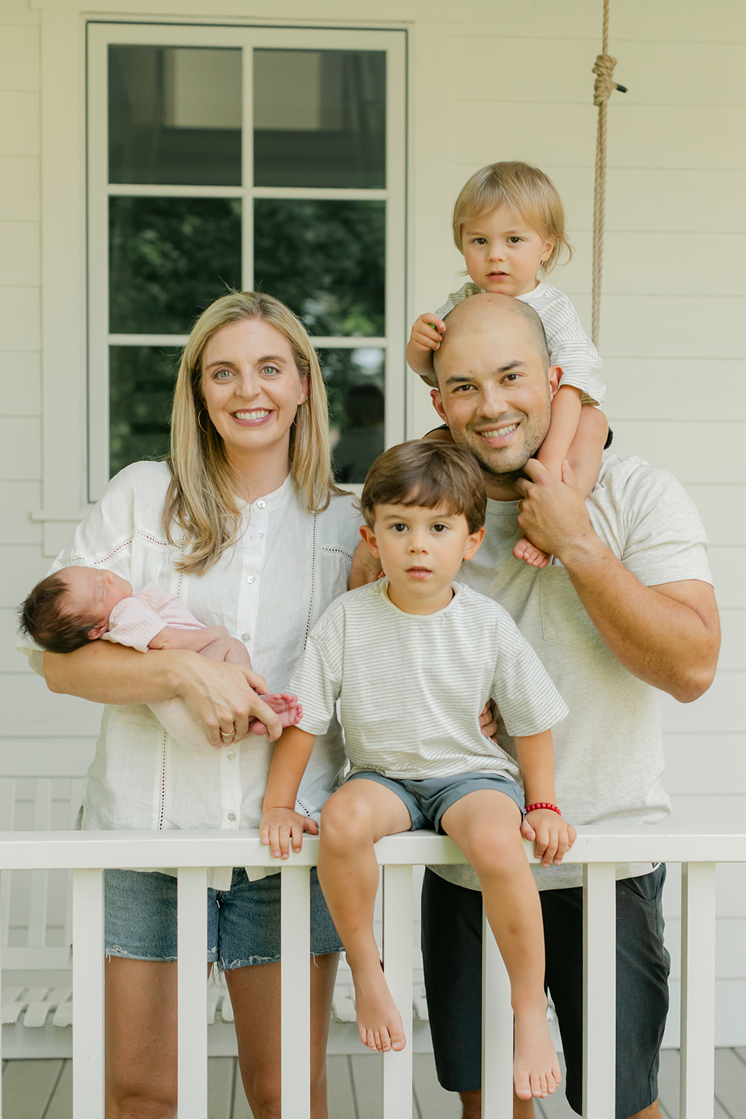 family in front porch. family photos during newborn session 