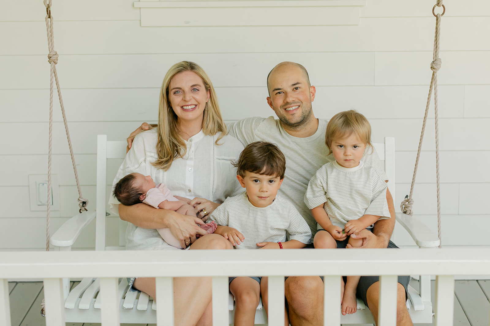 family photo in front porch for newborn session