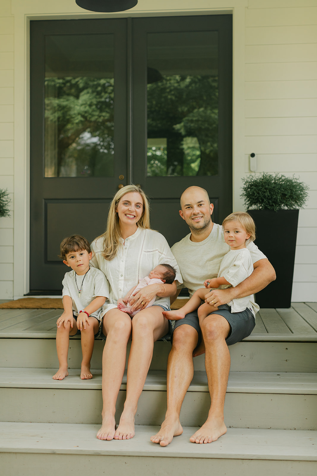 family in front porch. family photos during newborn session 