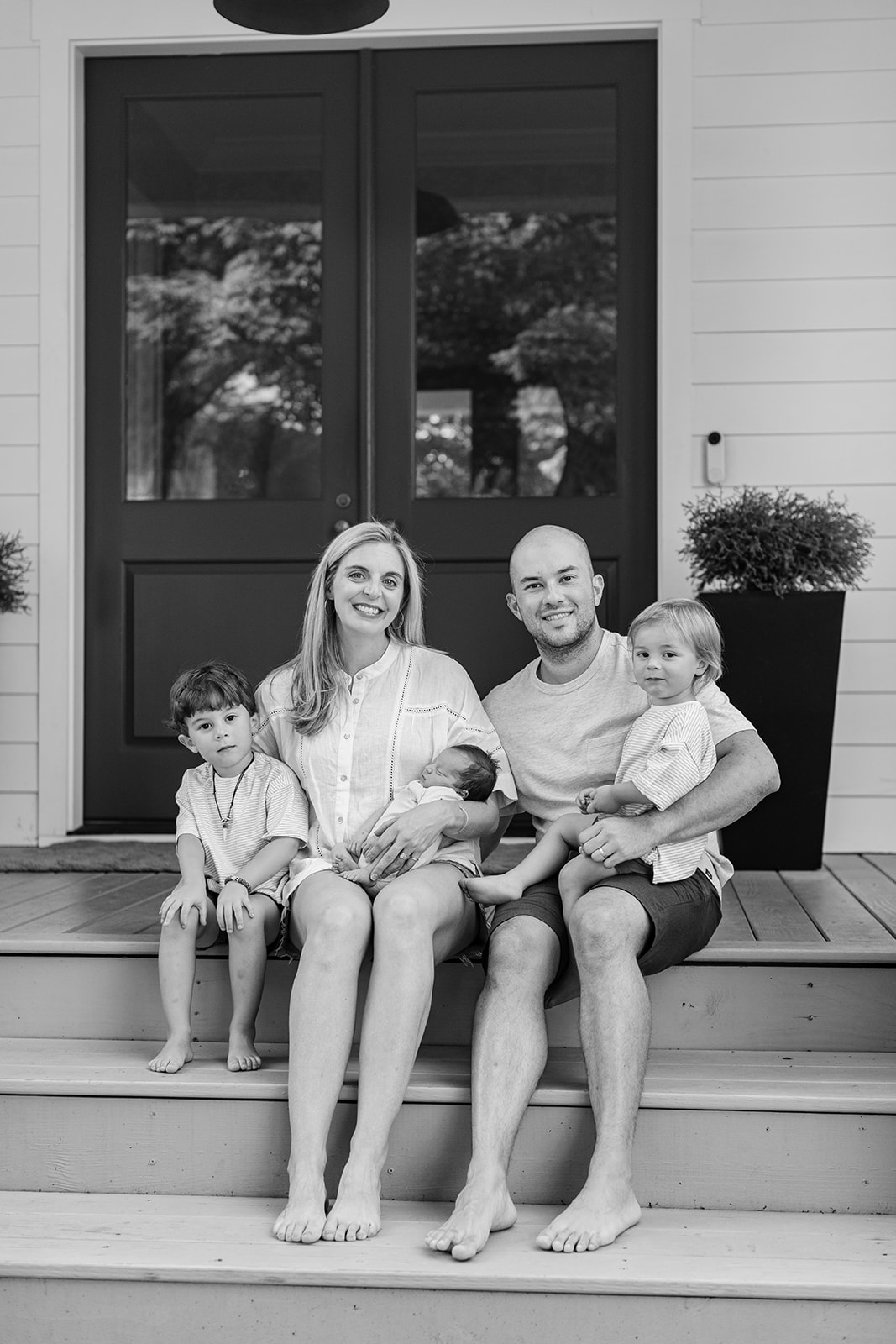 family in front porch. family photos during newborn session 
