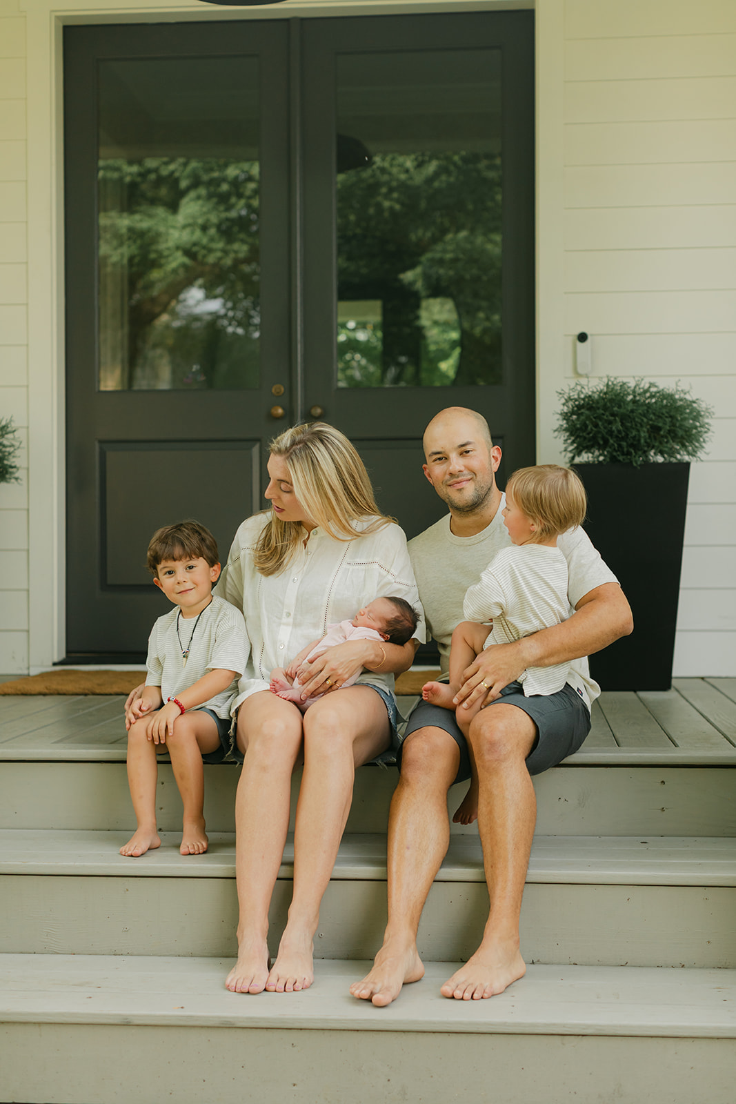family in front porch. family photos during newborn session 