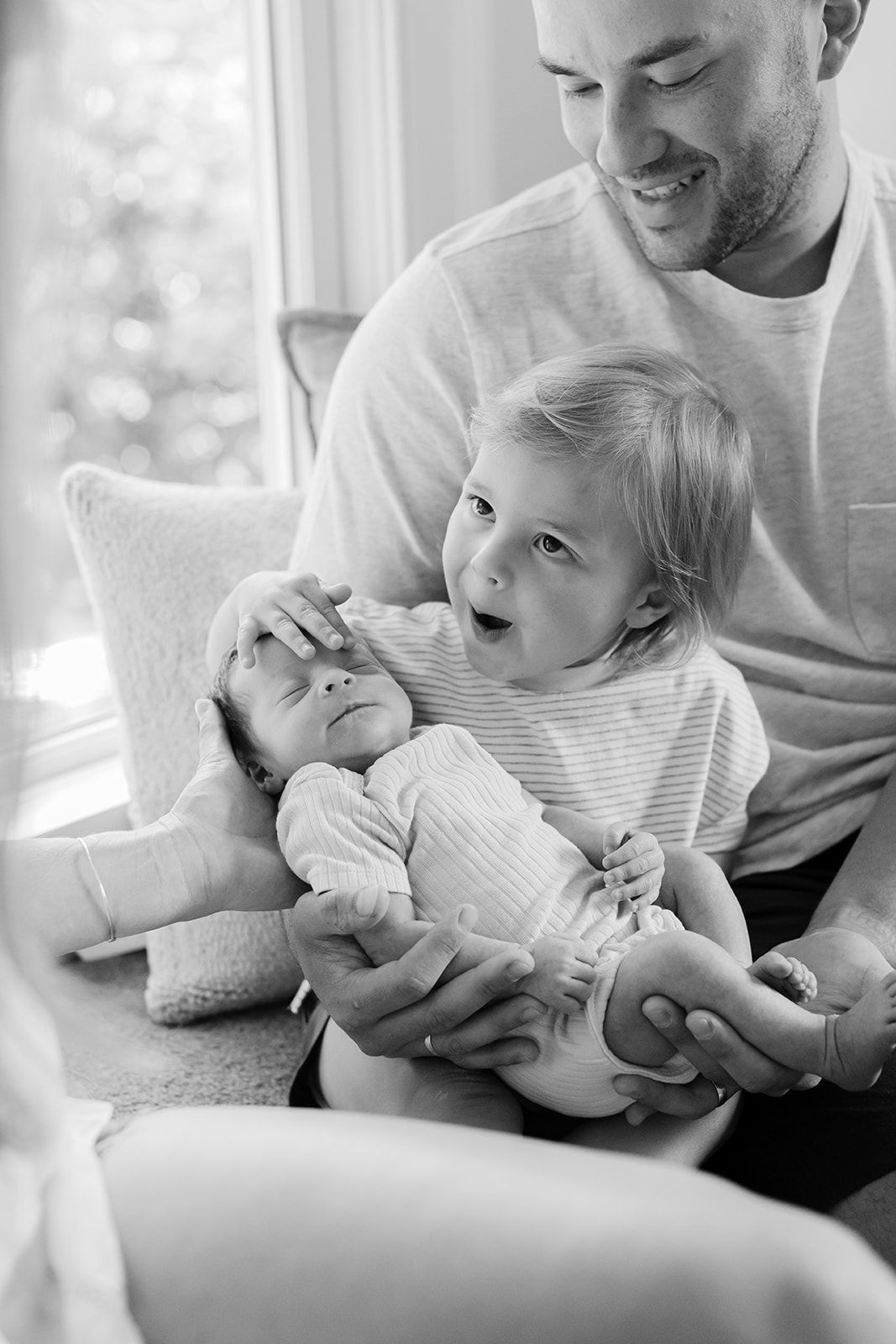 dad with son and newborn daughter