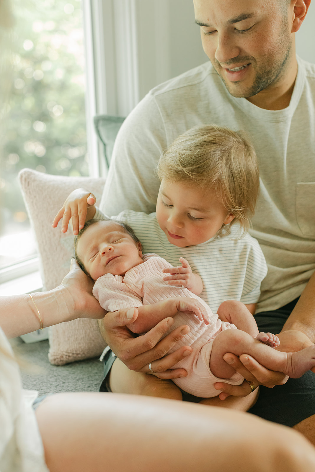dad with son and newborn daughter
