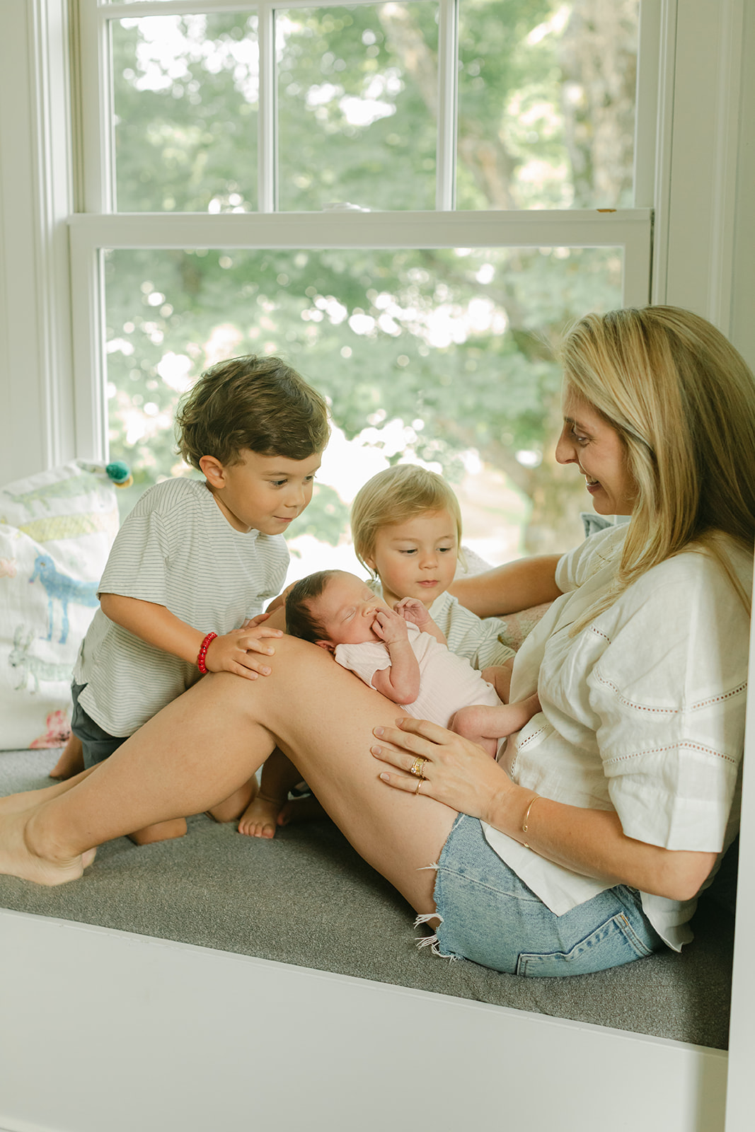 mama and her two young boys and newborn daughter