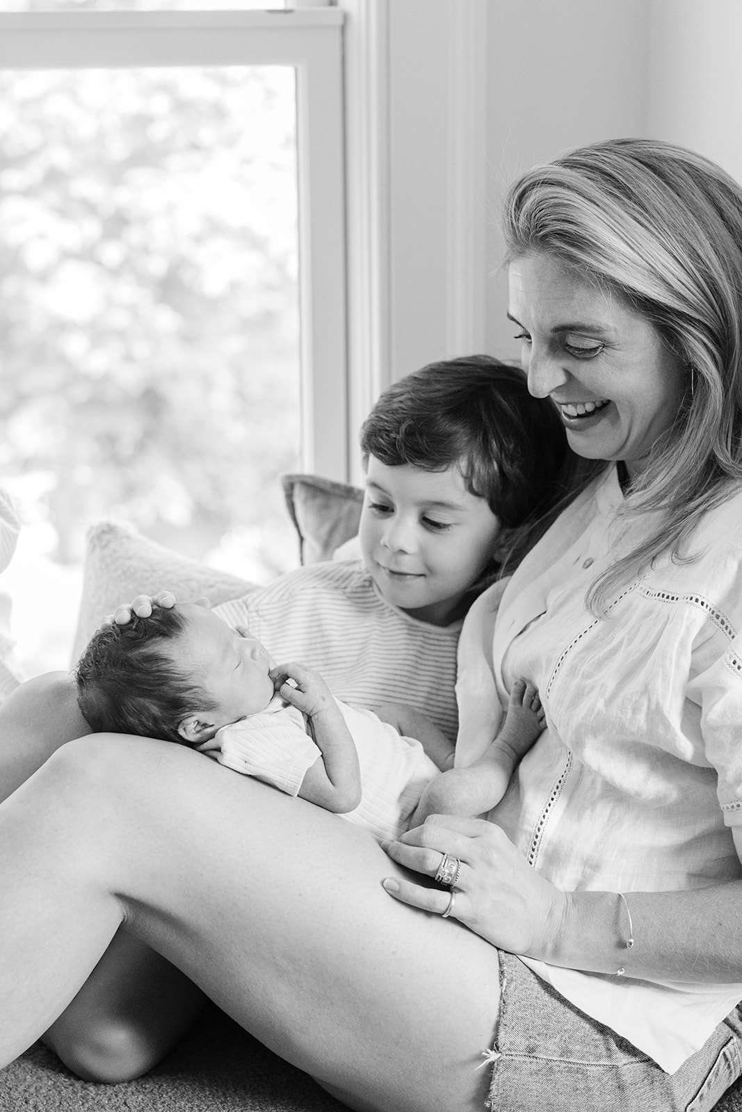 mama and her two young boys and newborn daughter