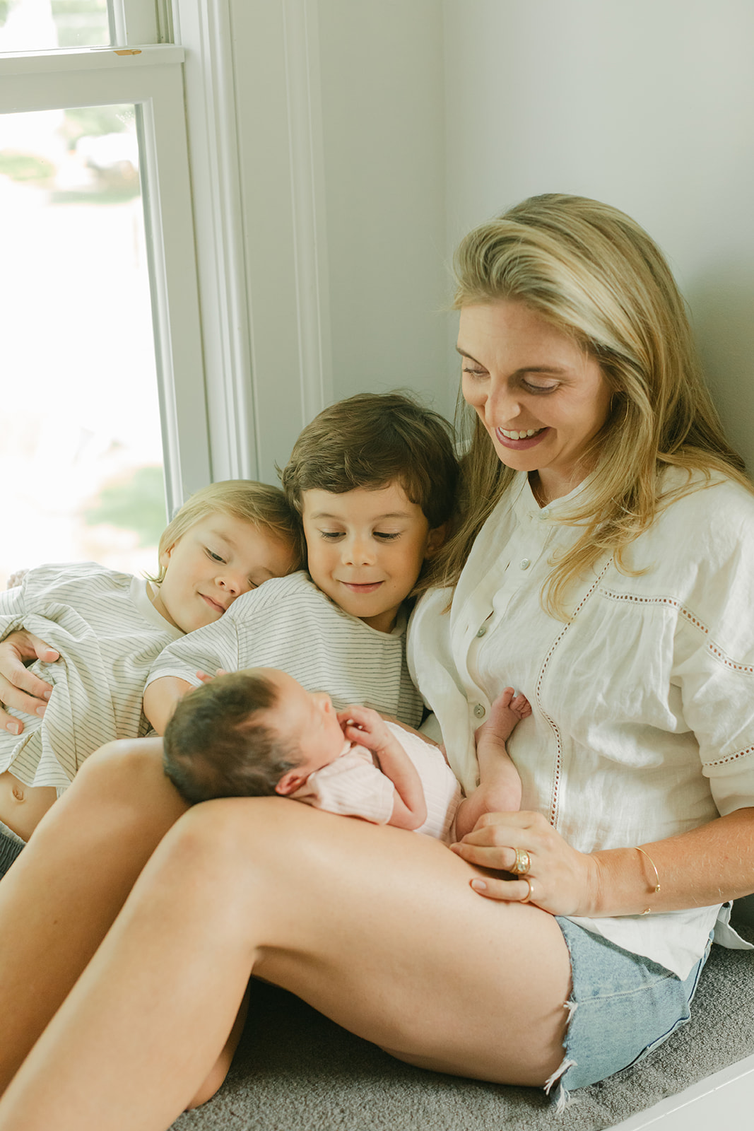 mama and her two young boys and newborn daughter