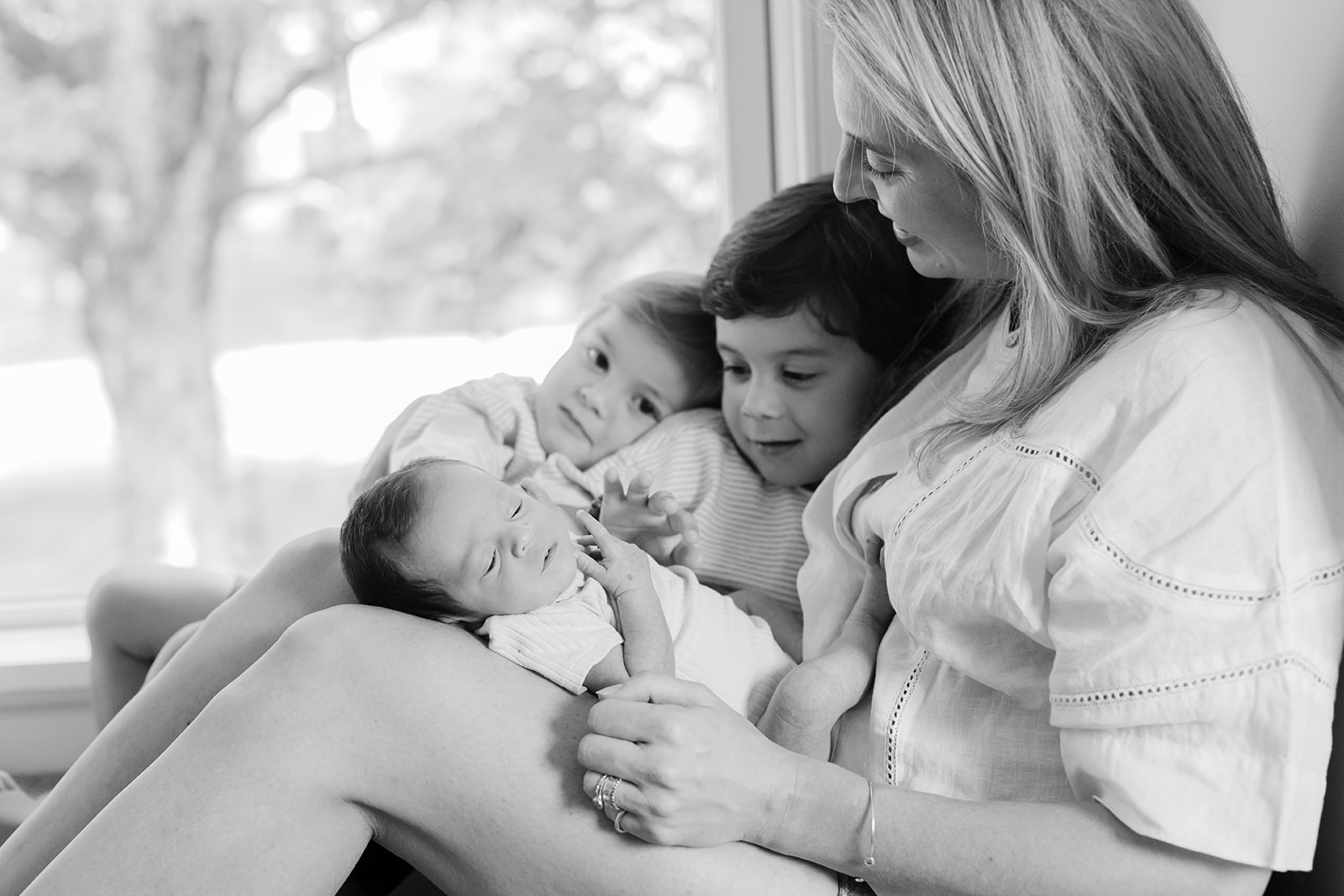 mama and her two young boys and newborn daughter