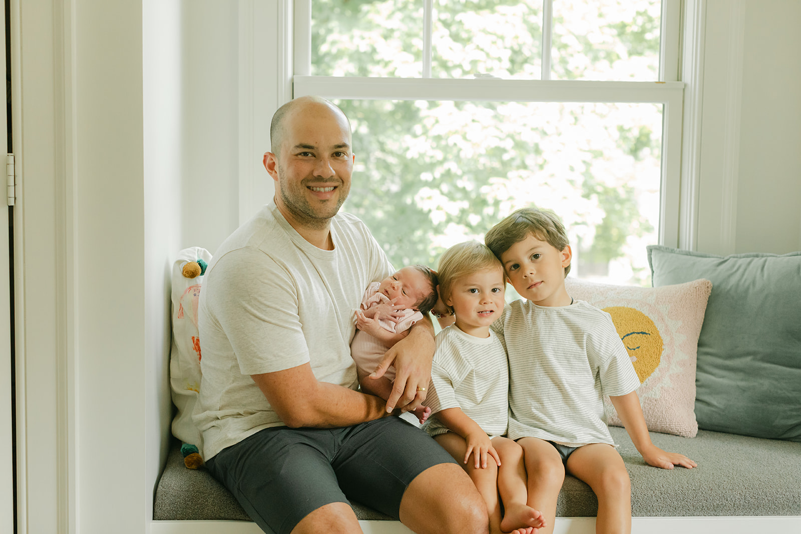 dad and his two young boys and newborn daughter