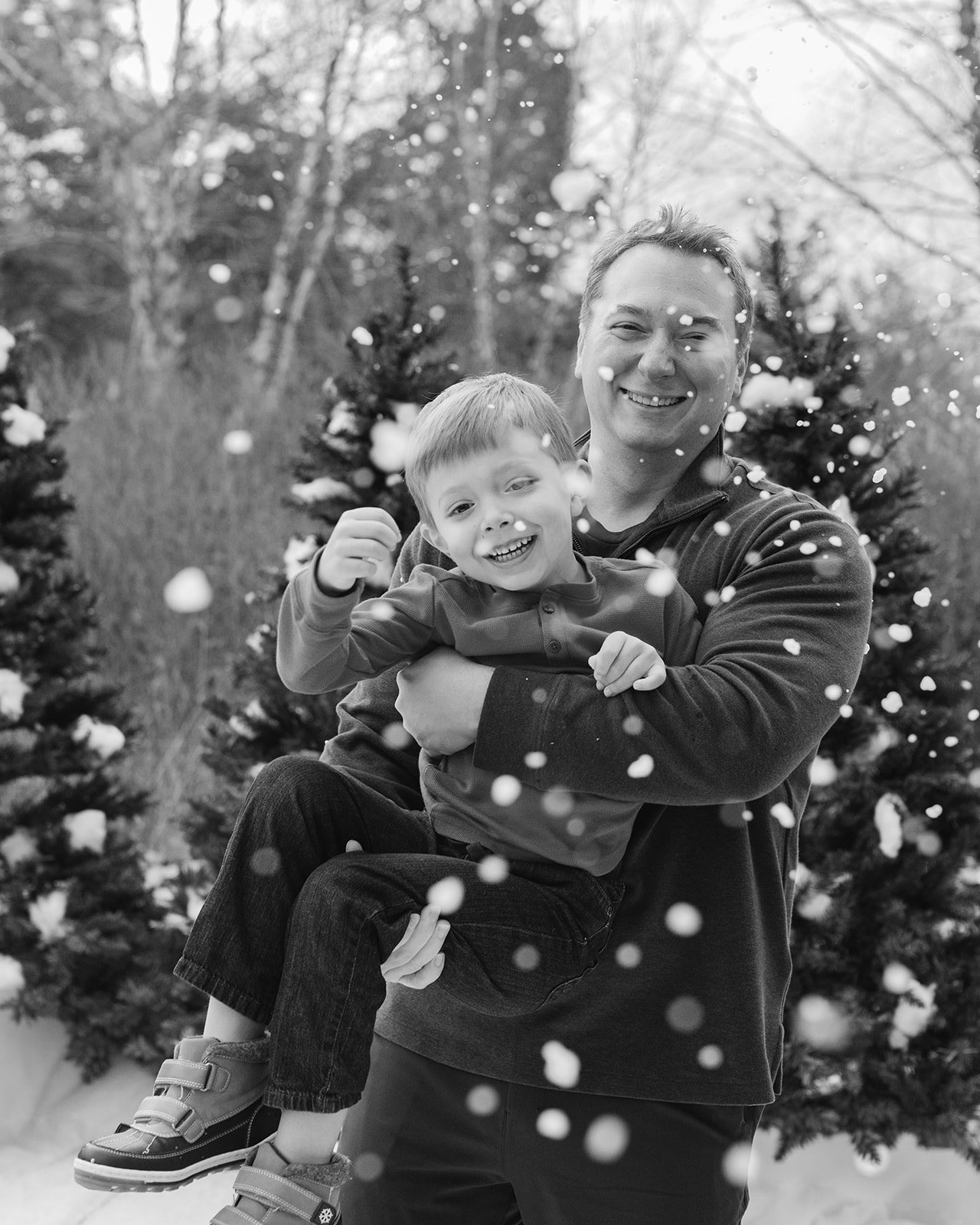 dad and son. snowy christmas family photos