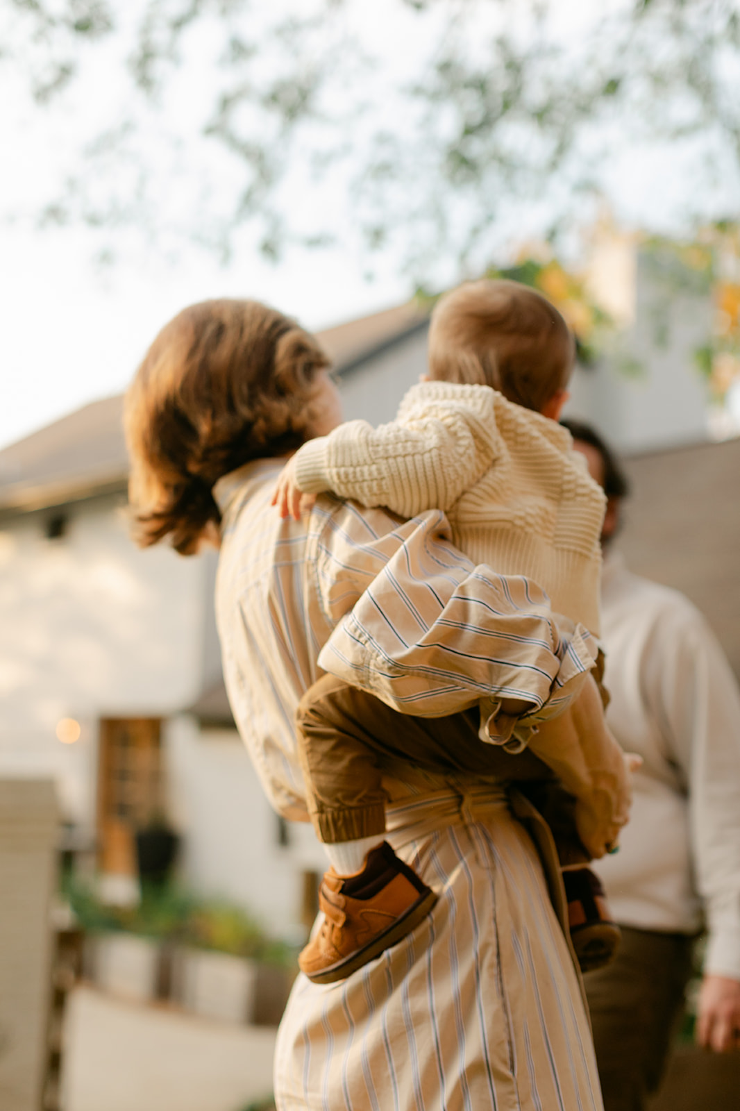 mama carrying her young son during outdoor fall family photos