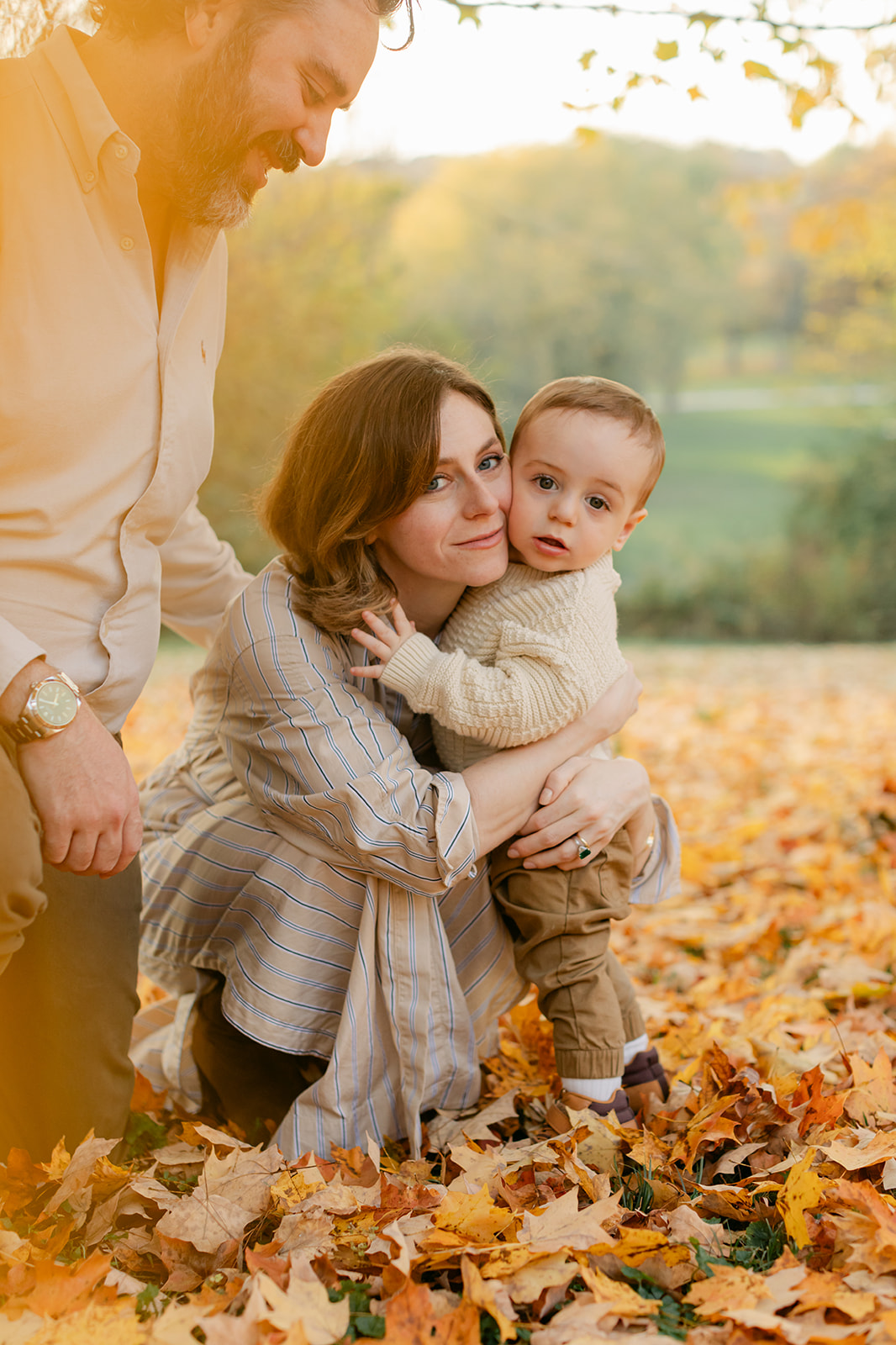 outdoor fall family session. mama hugging son