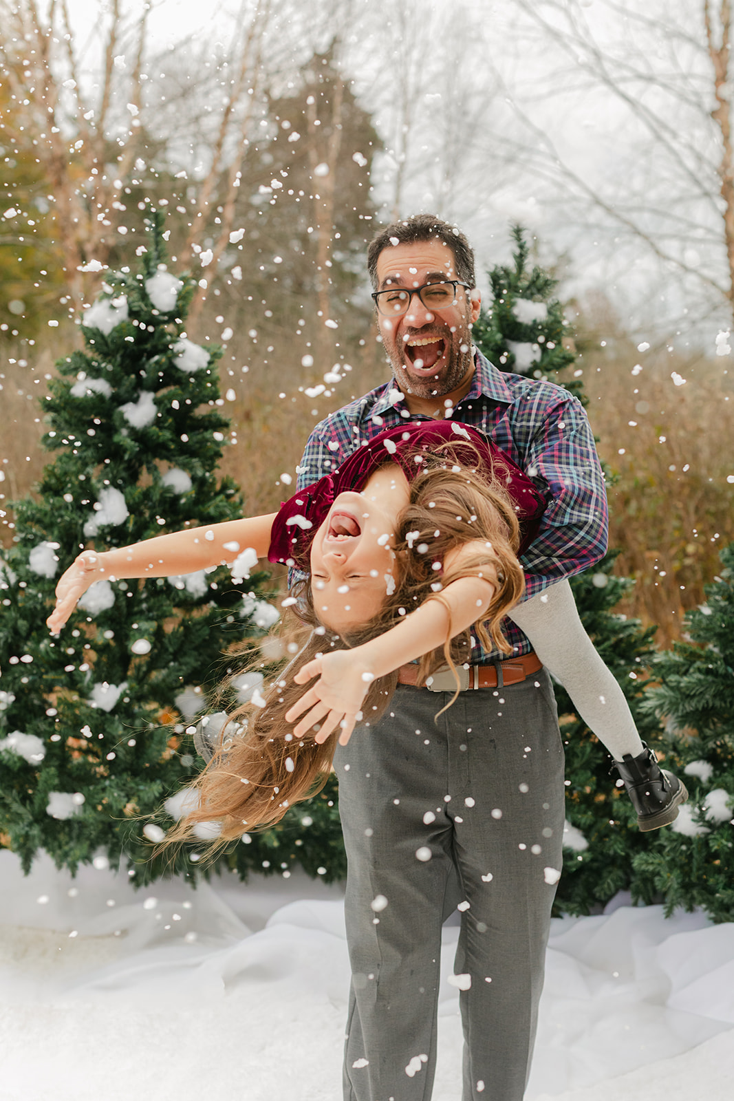 dad and daughter. snowy christmas family photos