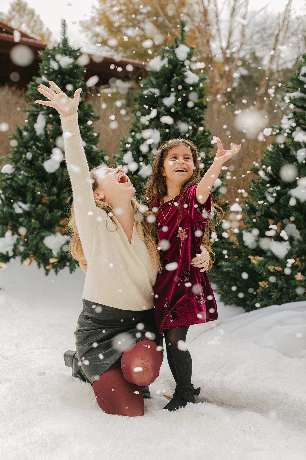 mom and daughter. snowy christmas family photos