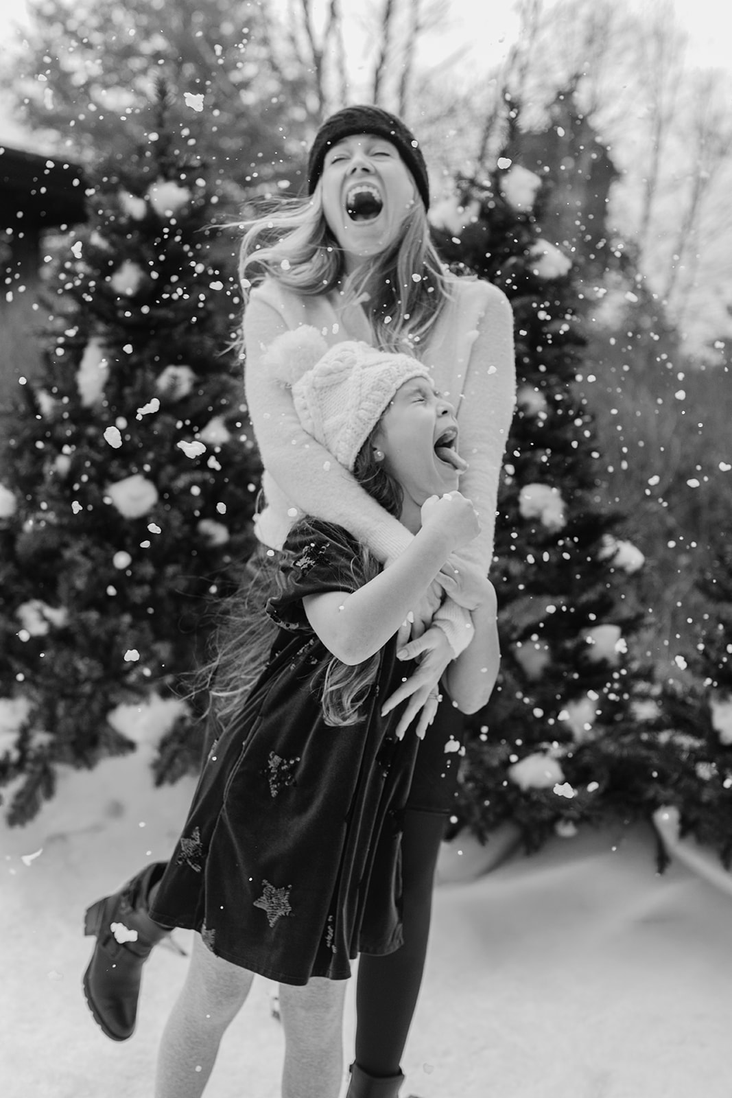 mom and daughter. snowy christmas family photos