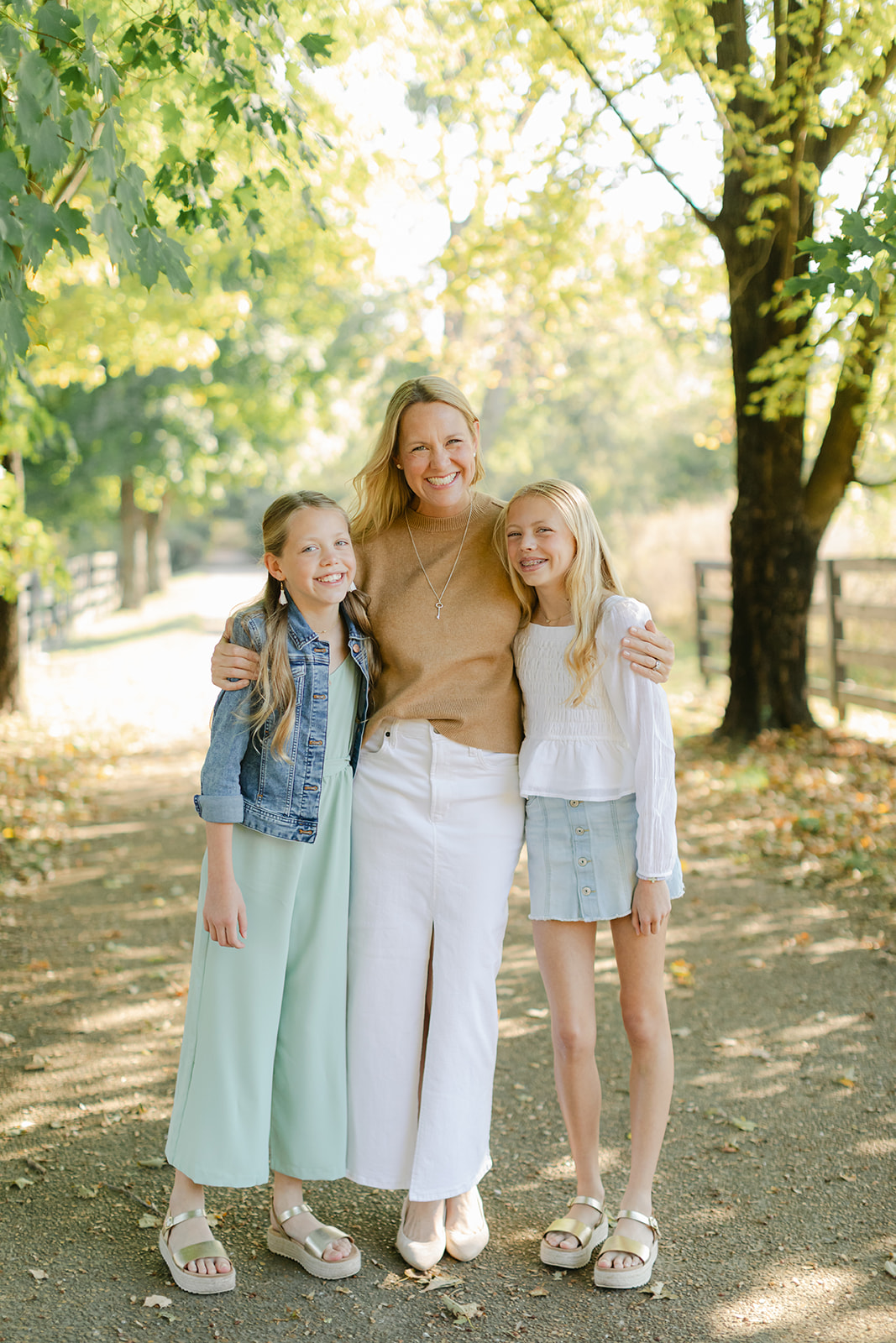 mom and two tween (teenager) daughters during outdoor family photos