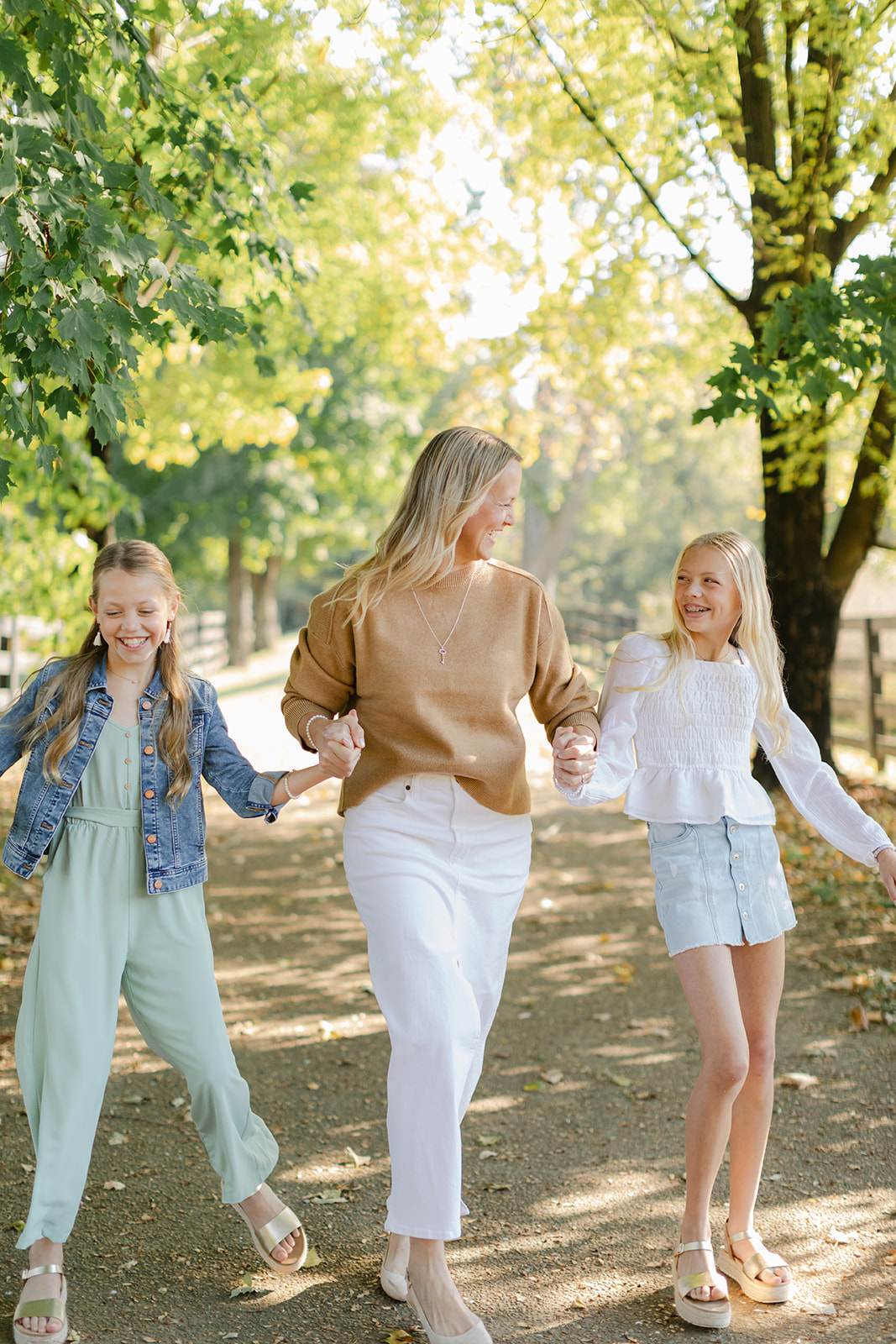 mom and two tween (teenager) daughters during outdoor family photos