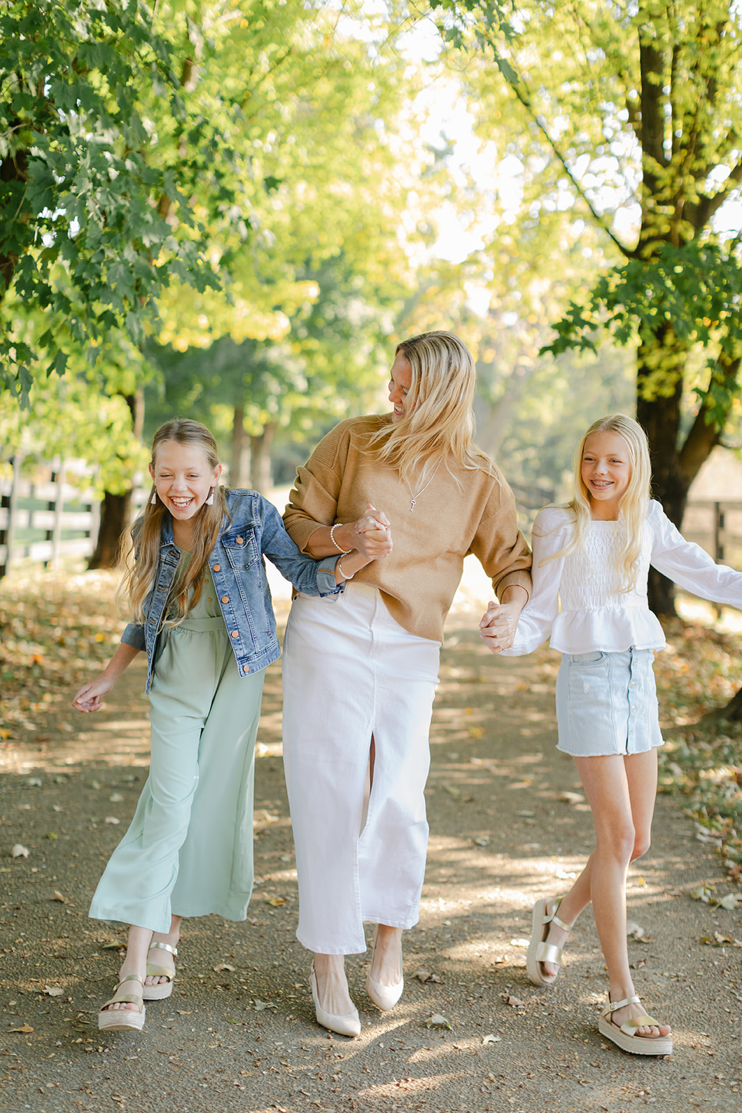 mom and two tween (teenager) daughters during outdoor family photos