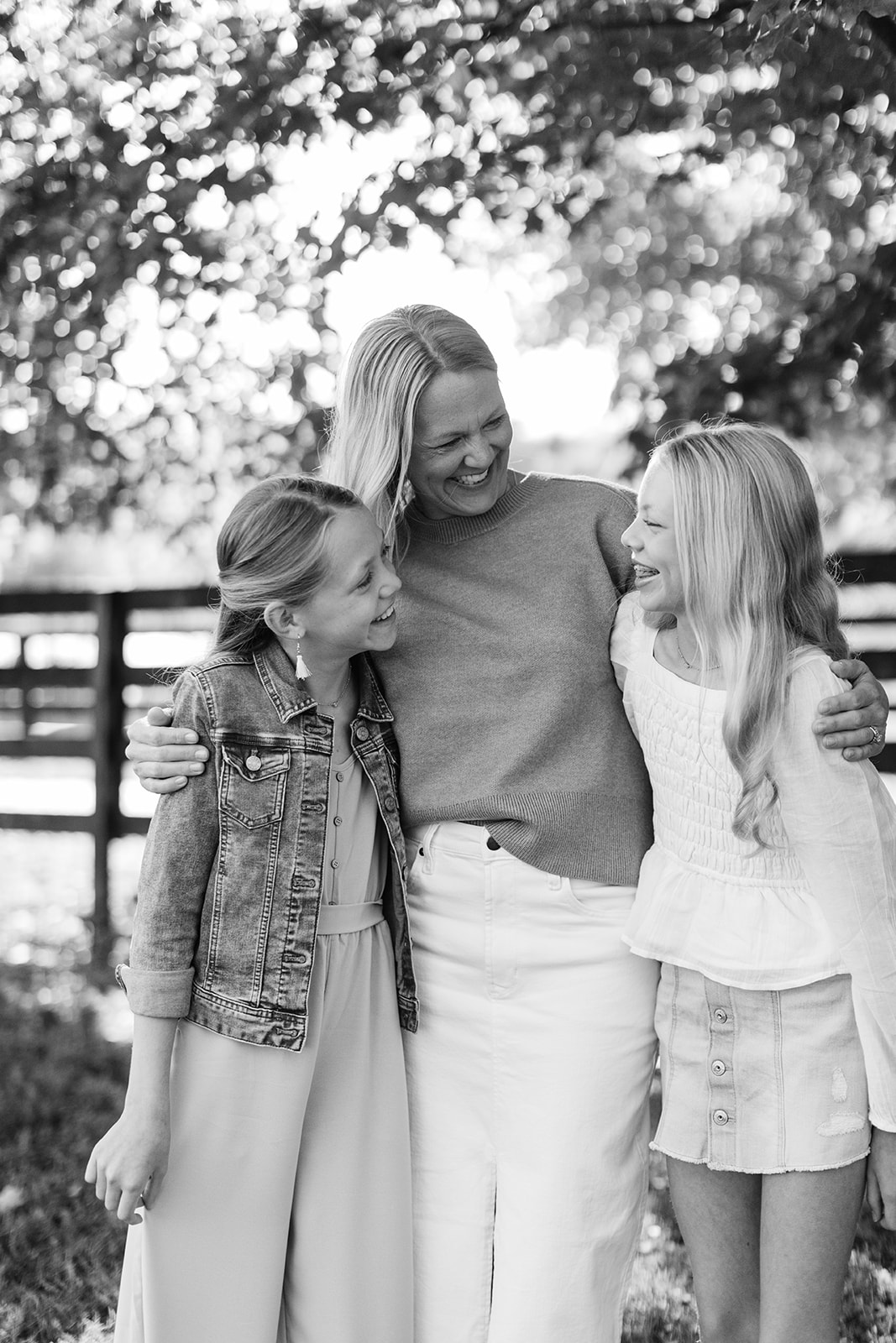 mom and two tween (teenager) daughters during outdoor family photos