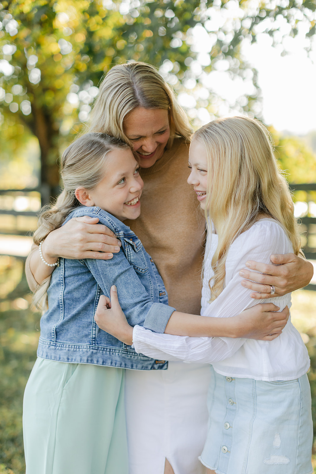 mom and two tween (teenager) daughters during outdoor family photos