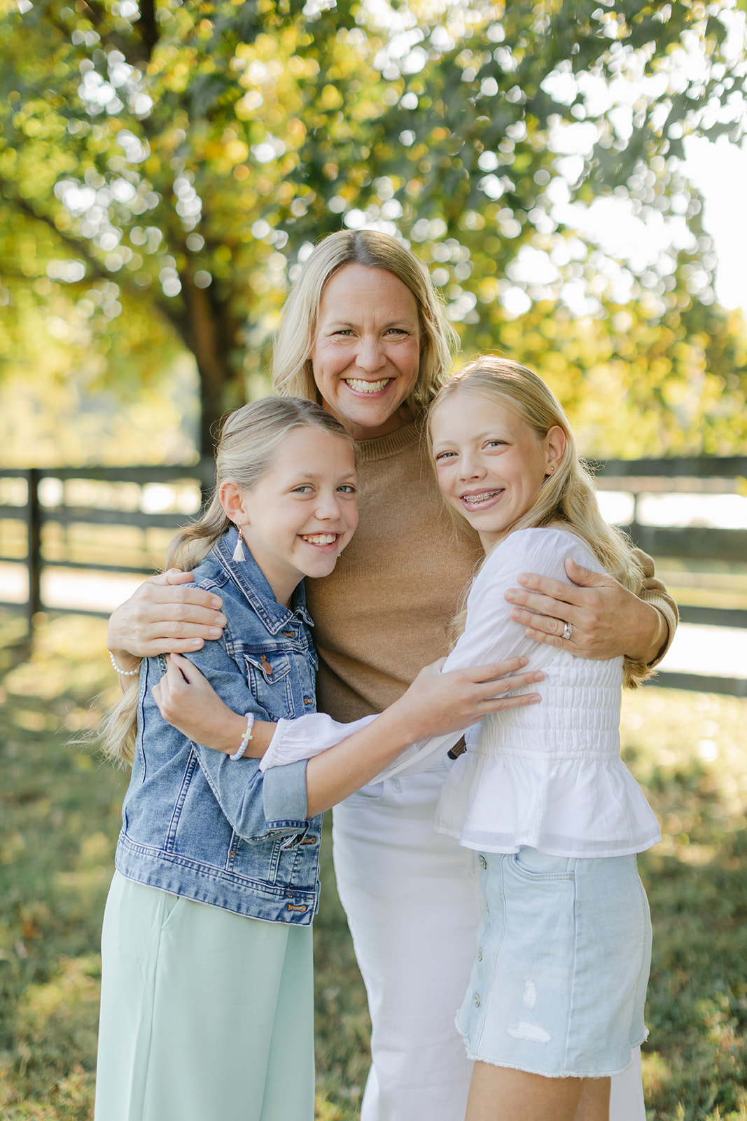 mom and two tween (teenager) daughters during outdoor family photos