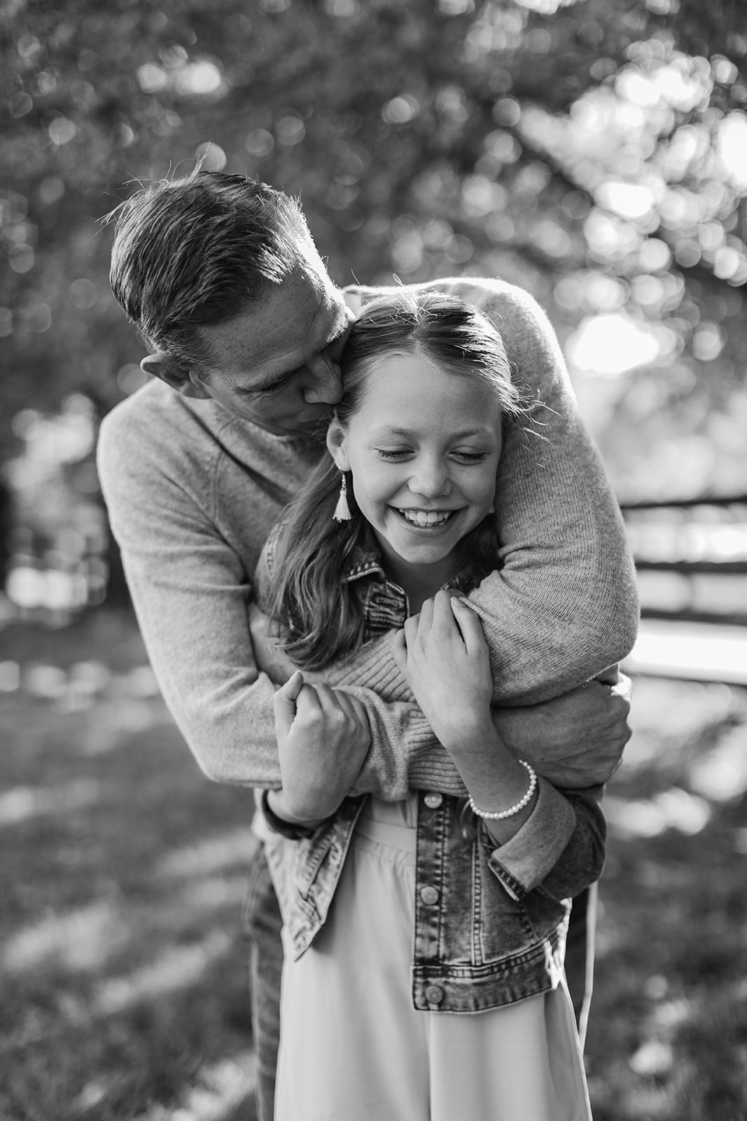 dad and tween (teenager) daughter during outdoor family photos