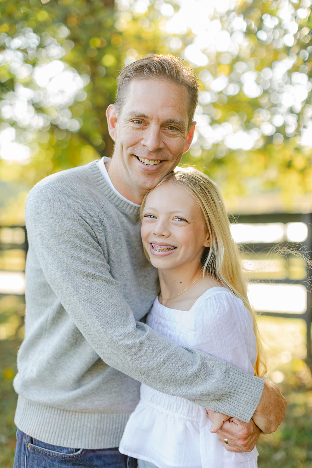 dad and tween (teenager) daughter during outdoor family photos