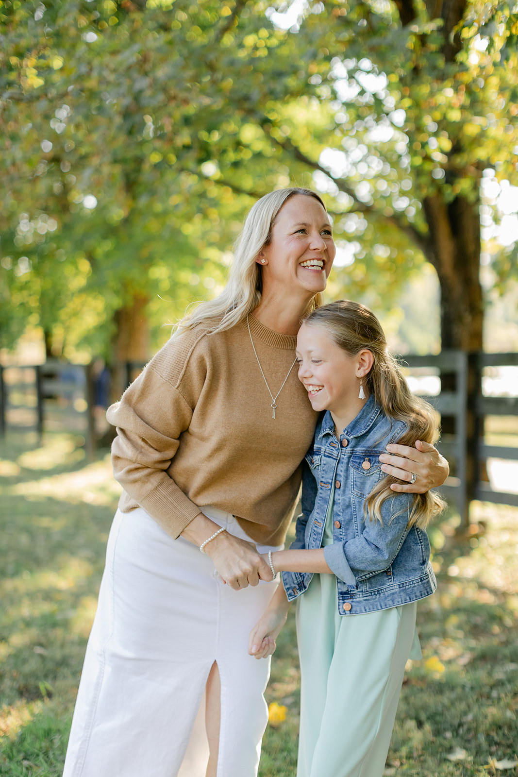 mom and tween (teenager) daughter during outdoor family photos
