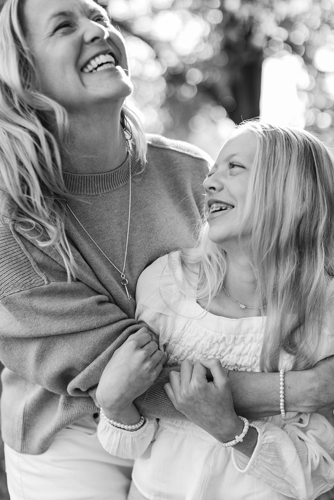 mom and tween (teenager) daughter during outdoor family photos