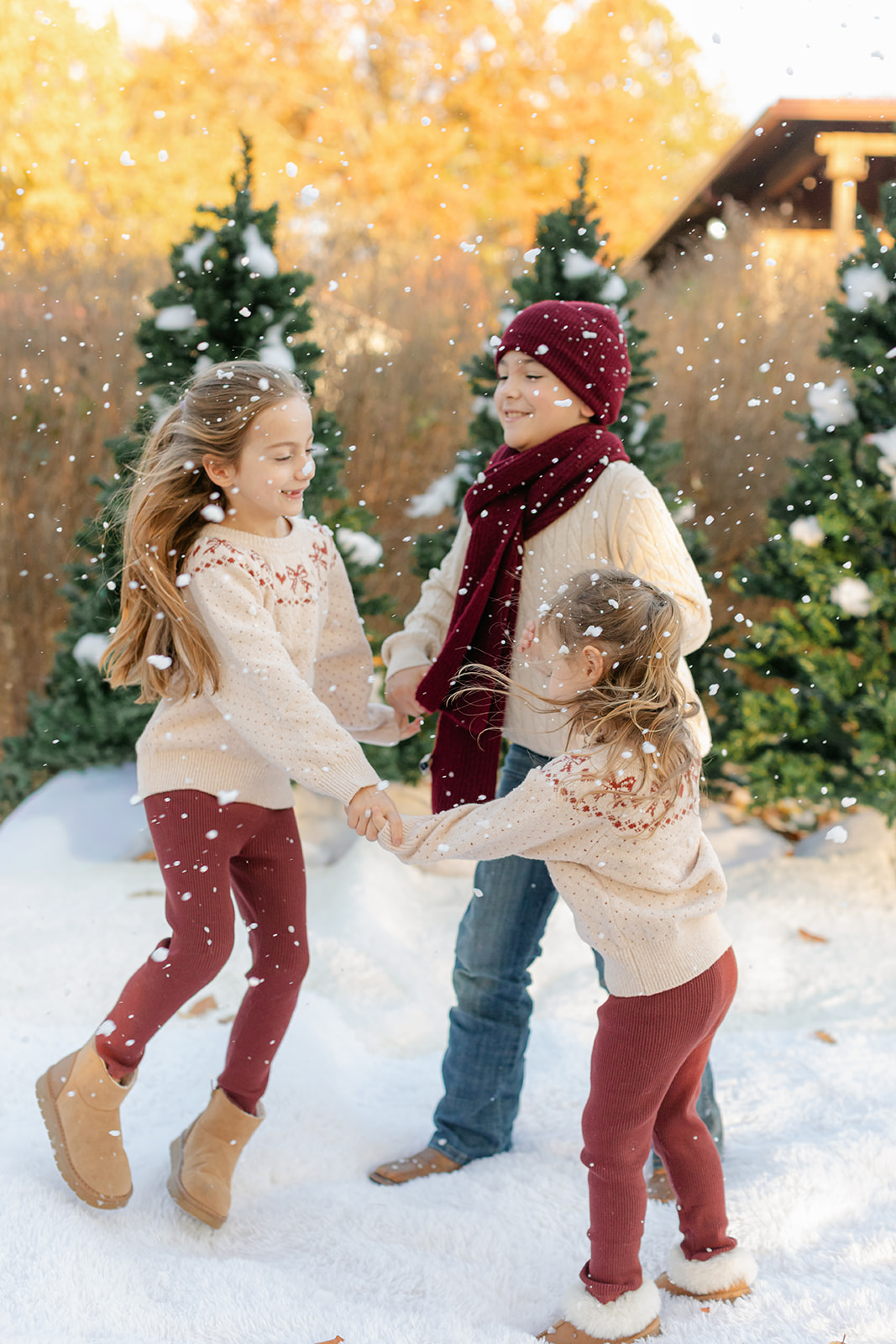 three siblings. outdoor christmas family photo.