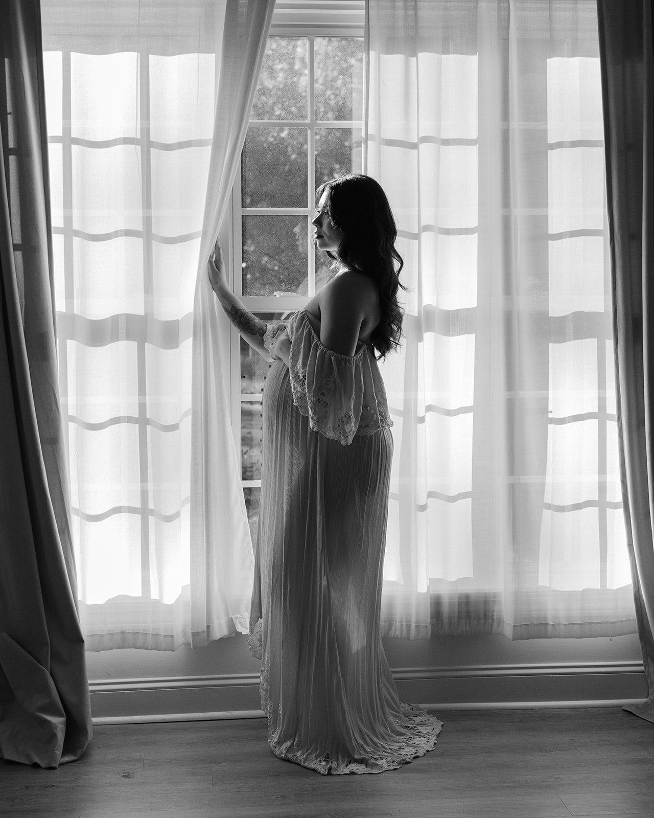 Maternity session. Woman in light blue dress