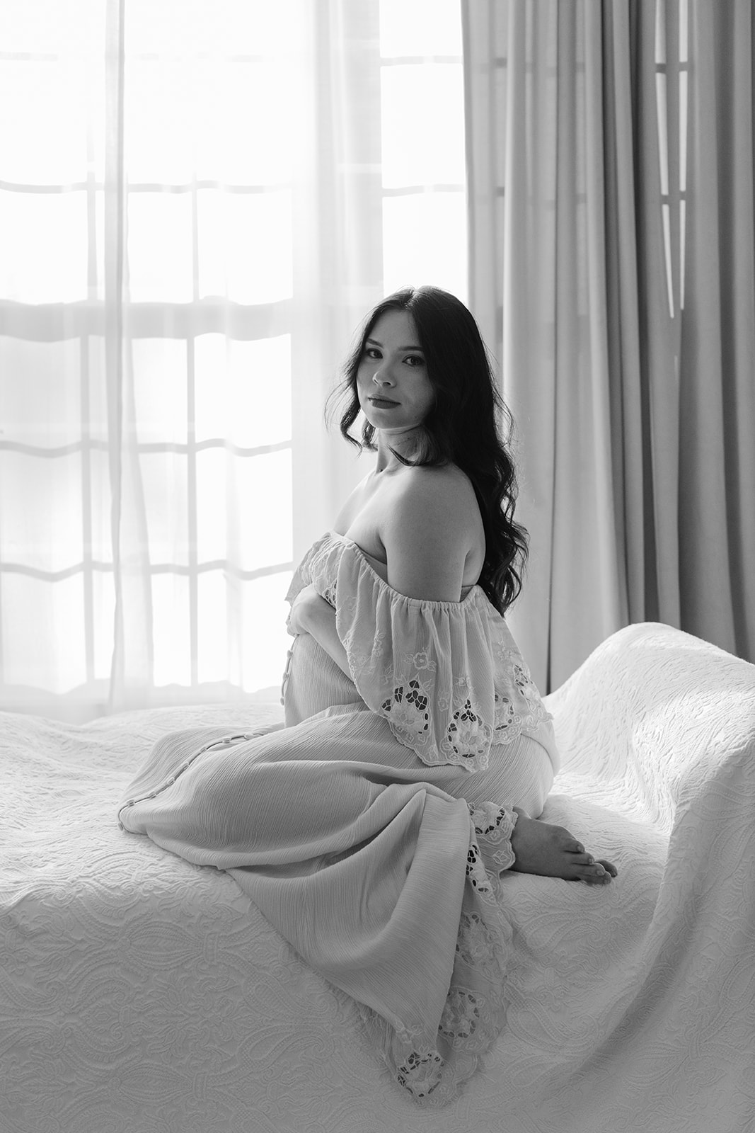 Maternity session. Woman in light blue dress