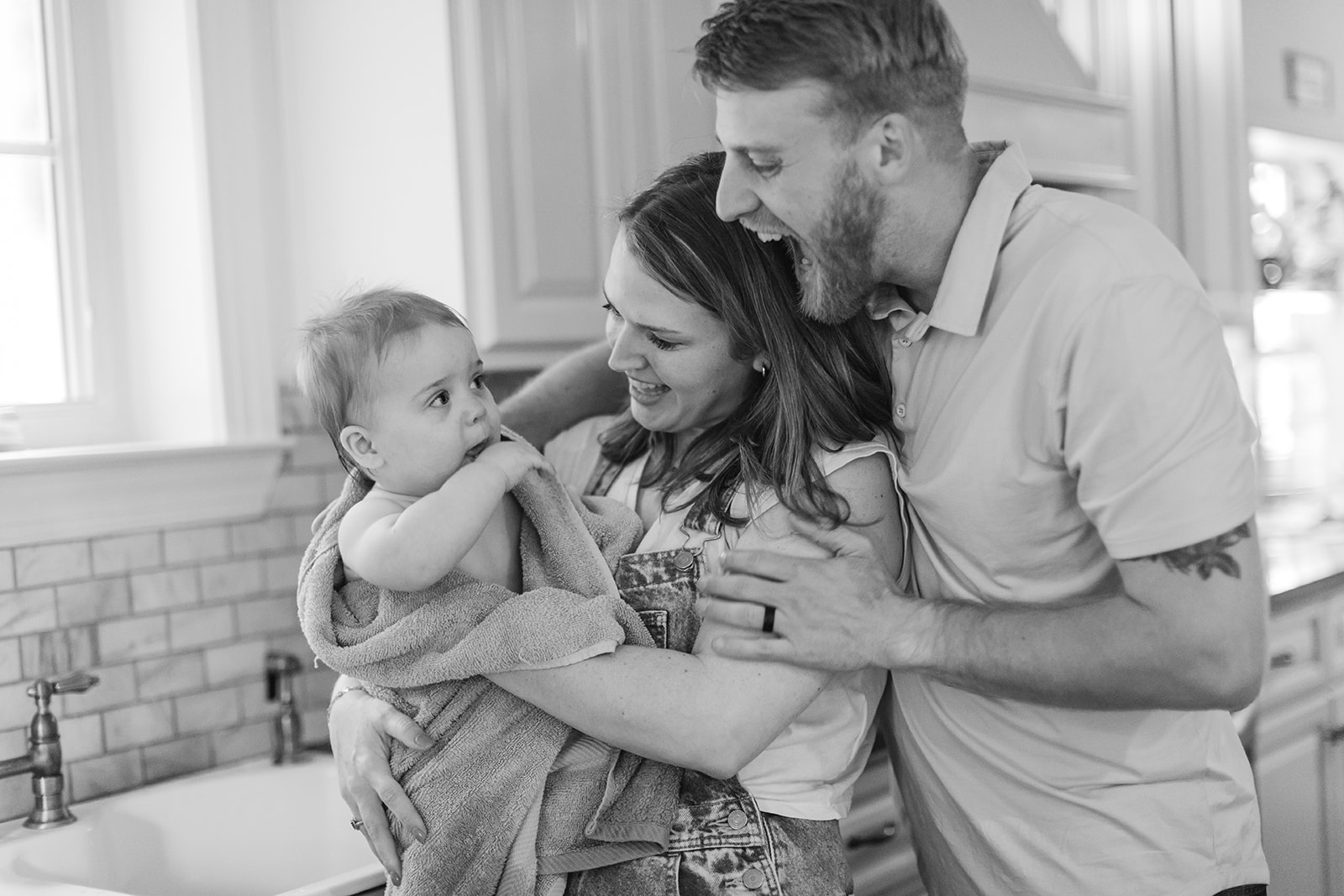 parents and son after kitchen sink bath