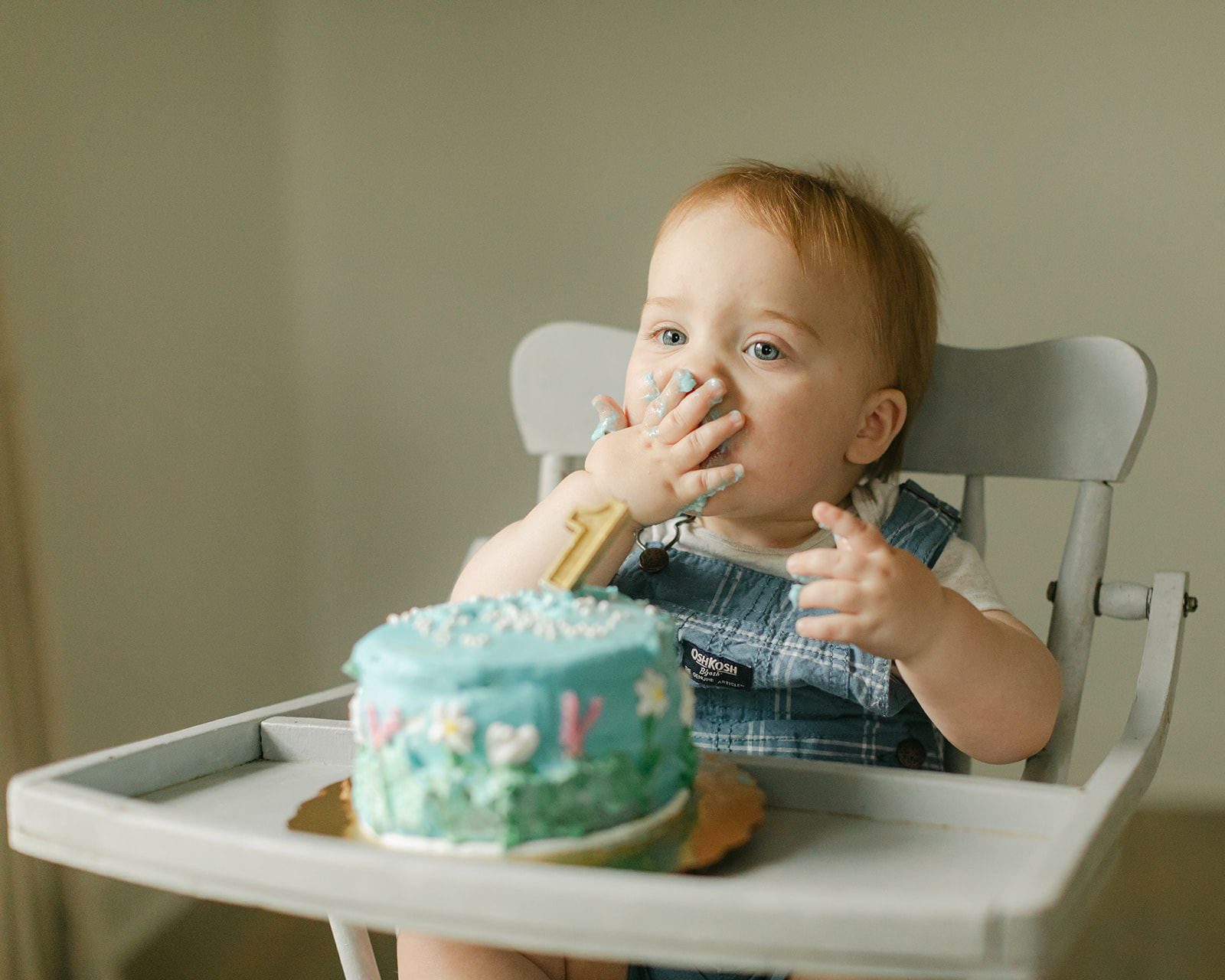 baby boy eating cake