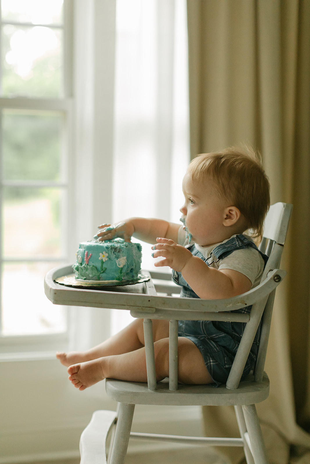 baby boy eating cake