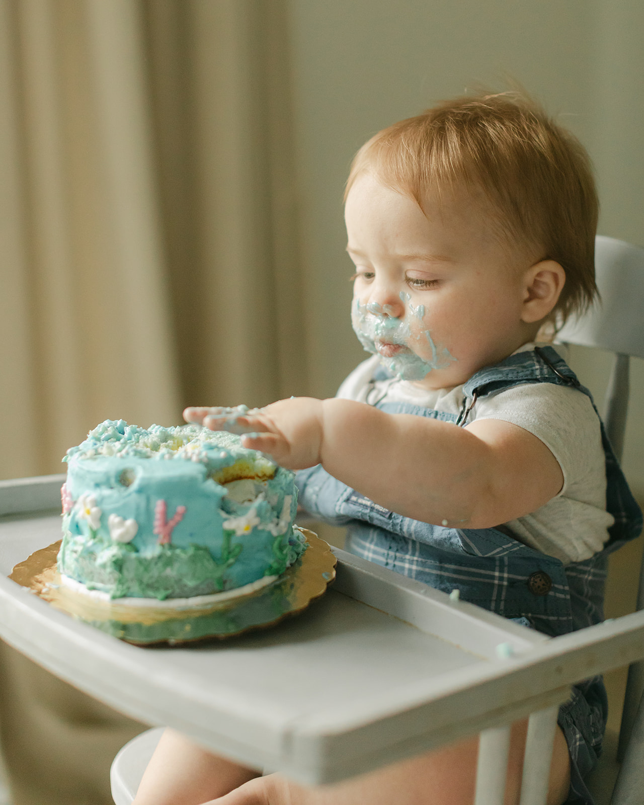baby boy eating cake
