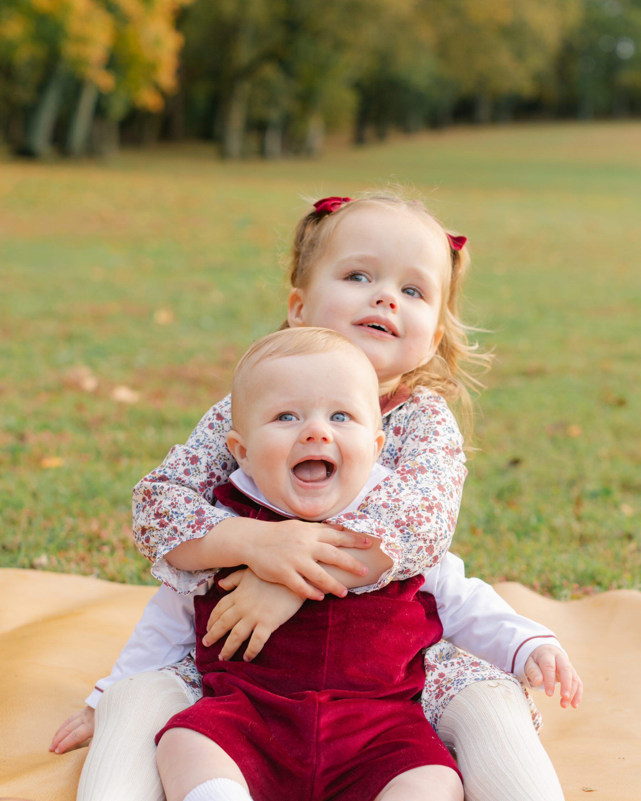 two siblings, little girl and baby boy