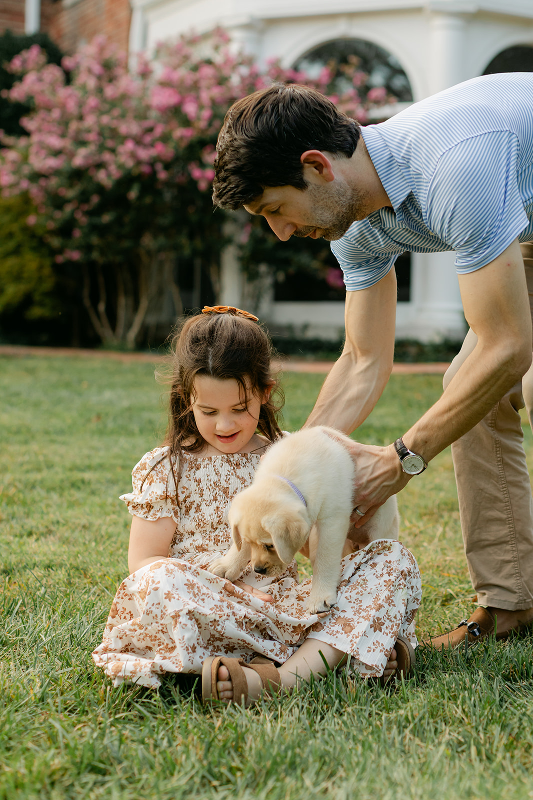 dad daughter and puppy