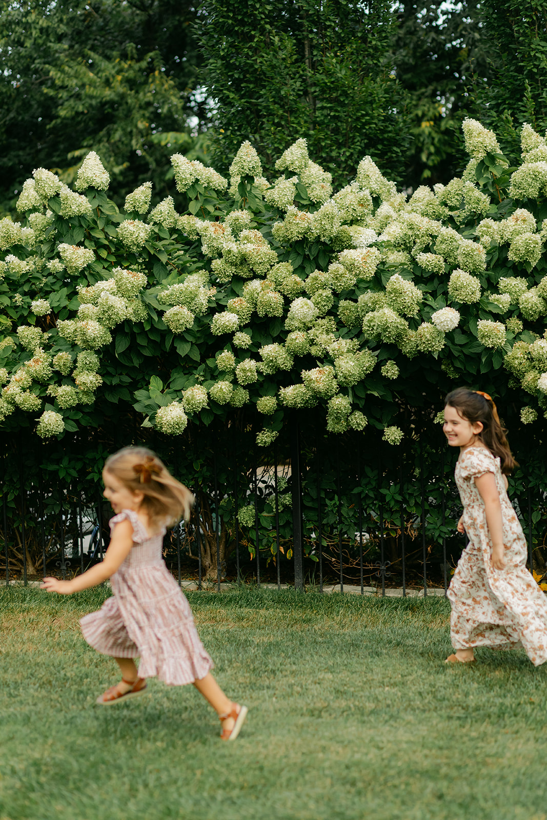two sisters playing and running around