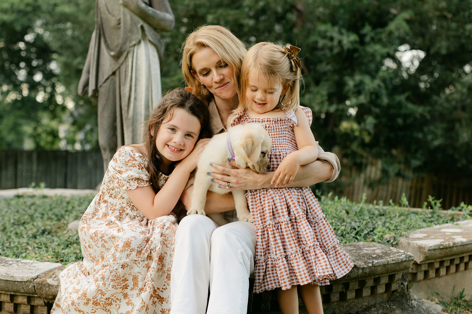 mom, two daughters and new puppy