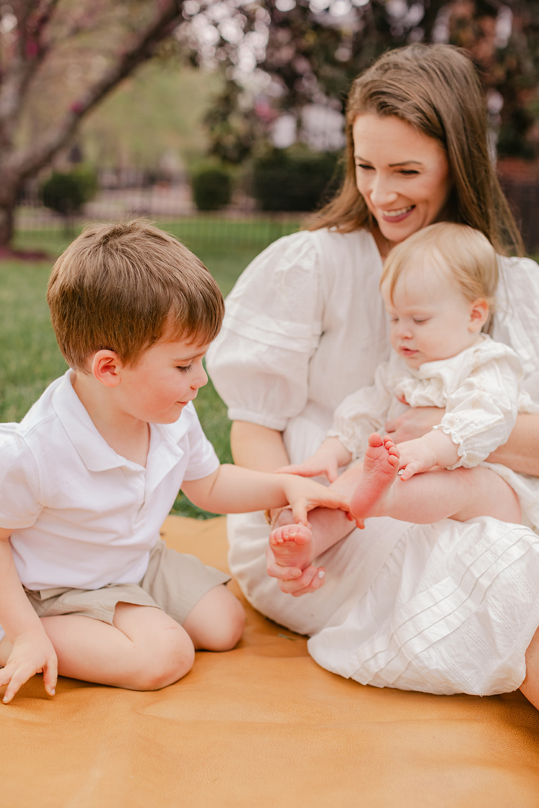 mom with her two kids spring family photos