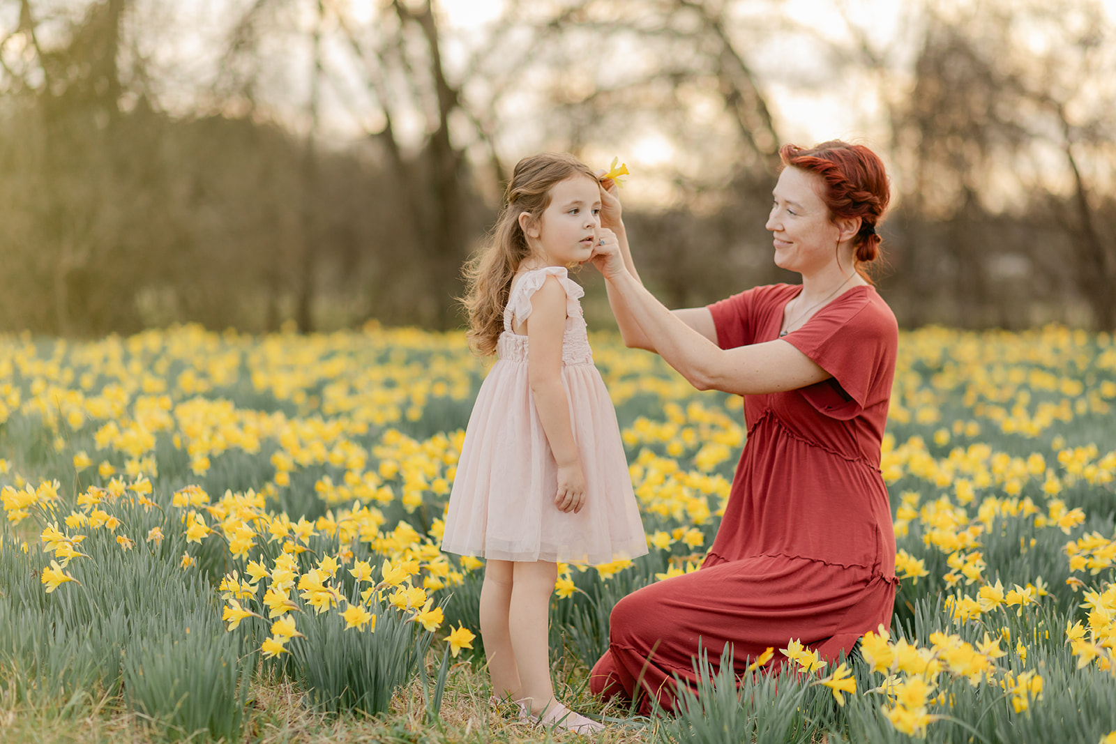 mama and daughter in daffodil field
