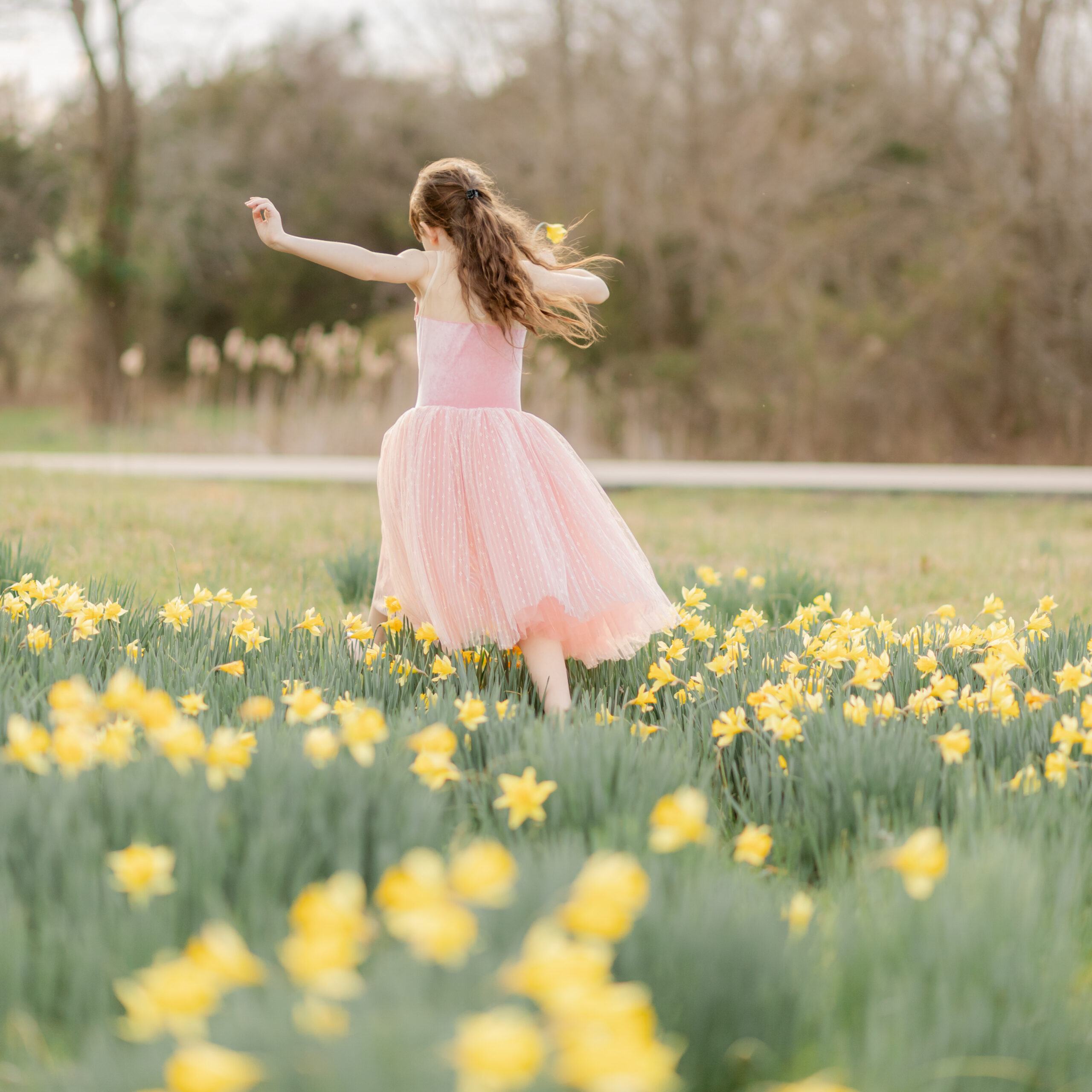 mama and daughter in daffodil field