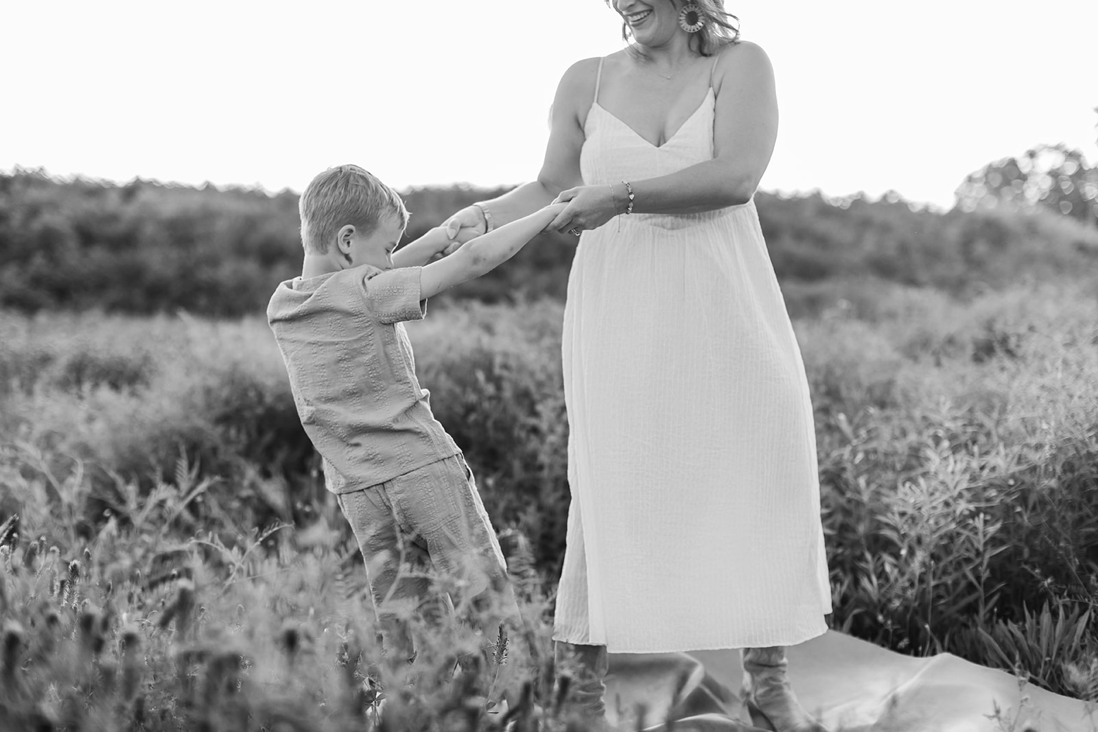 mother and son. Outdoor photo session in green field.