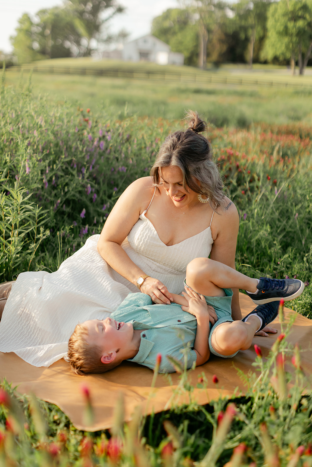 mother and son. Outdoor photo session in green field.