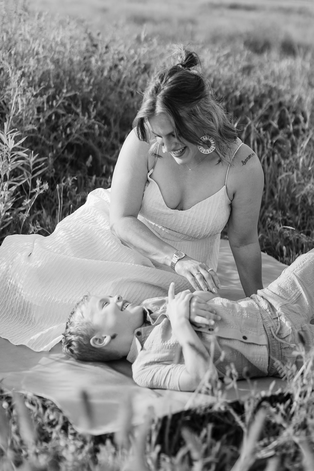 mother and son. Outdoor photo session in green field.